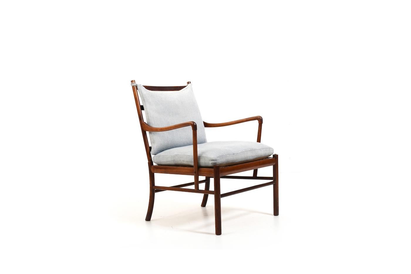 Vintage „Colonial Chair“ by Ole Wanscher for Poul Jeppesen 1949. Model PJ-149.  Produced in 1950s. Made in rosewood and orignial cushions in light blue fabric. All in original condition.