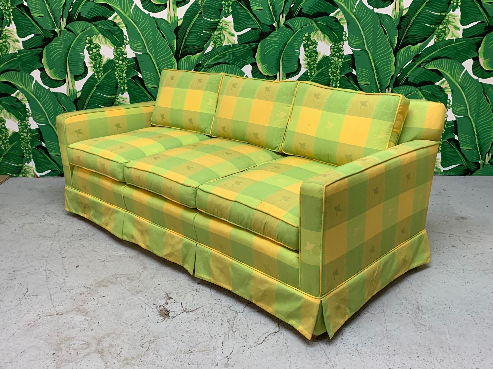 Vintage green and yellow plaid sofa in the manner of Dorothy Draper. Cheerful and fun print that will add a bright touch to any decor. Very good condition structurally and cosmetically with no stains or tears to fabric. 
 