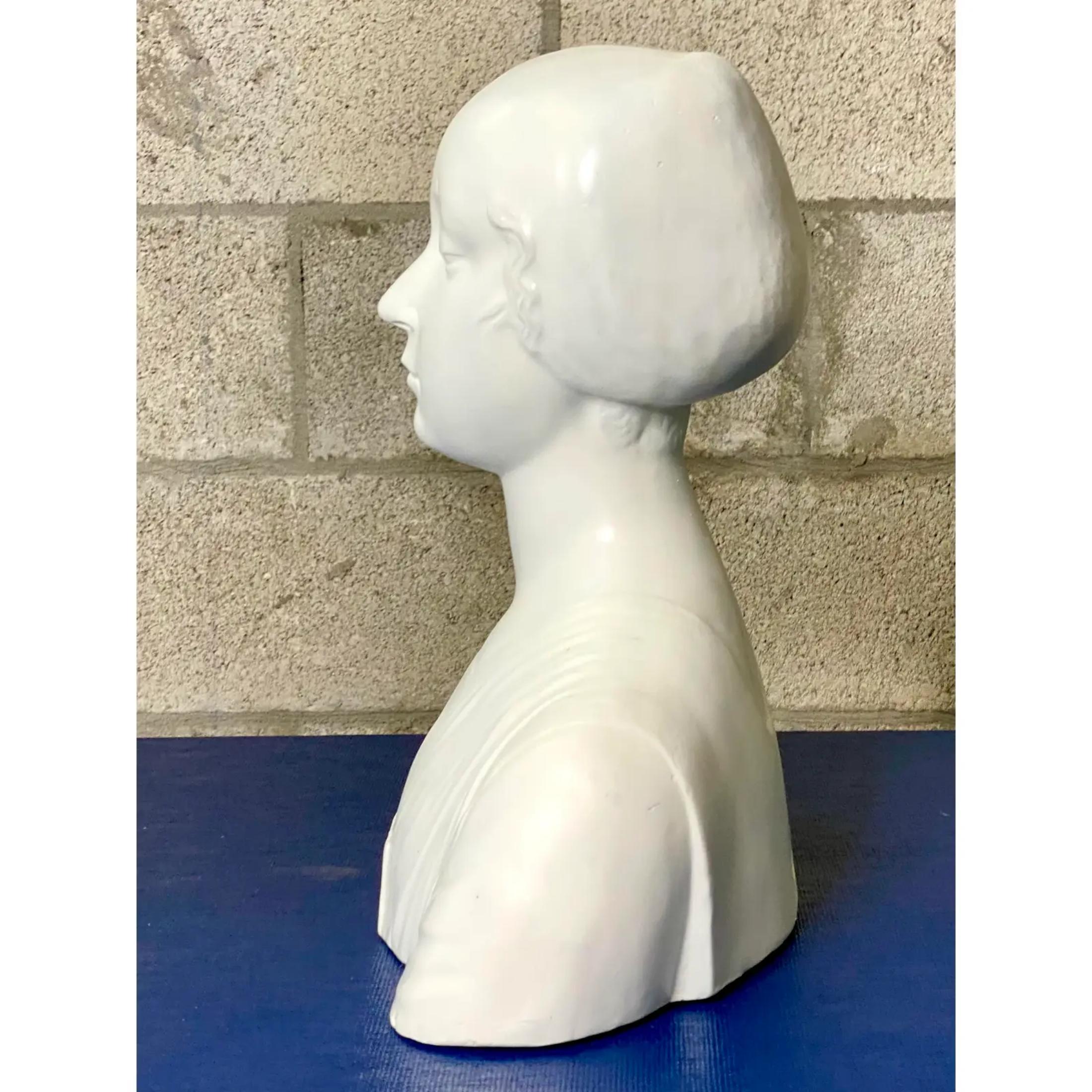 Gorgeous vintage plaster bust of female. Simple and chic sculpture. Makers mark in the back. Acquired from a Deal estate.