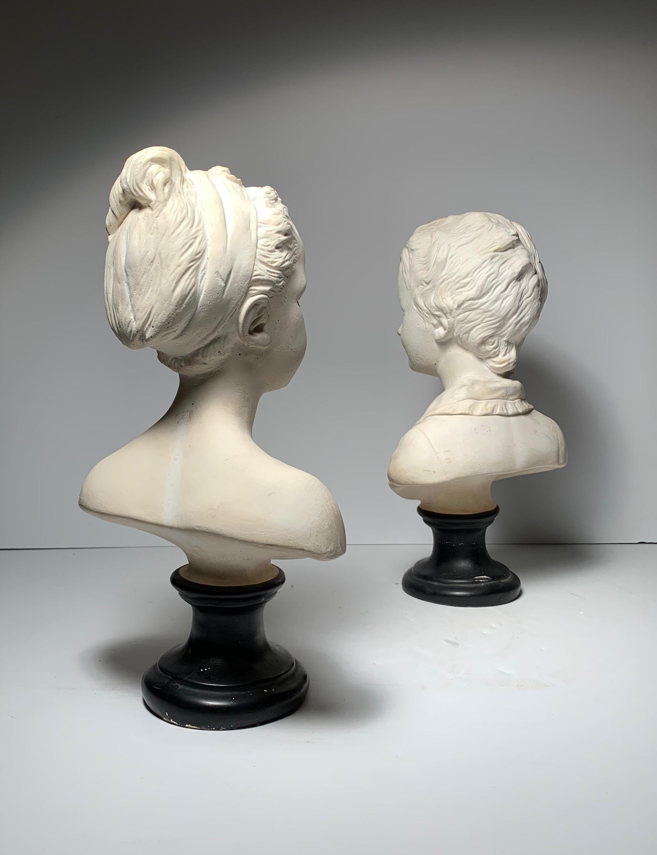 Vintage mid-20th century Decorative plaster Busts of Alexandre and Louise Brongniart modeled after the originals by Jean Antoine Houdon.
Both busts bear the impressed names Houdon faintly on back underside. No labels but possibly made by Borghese,