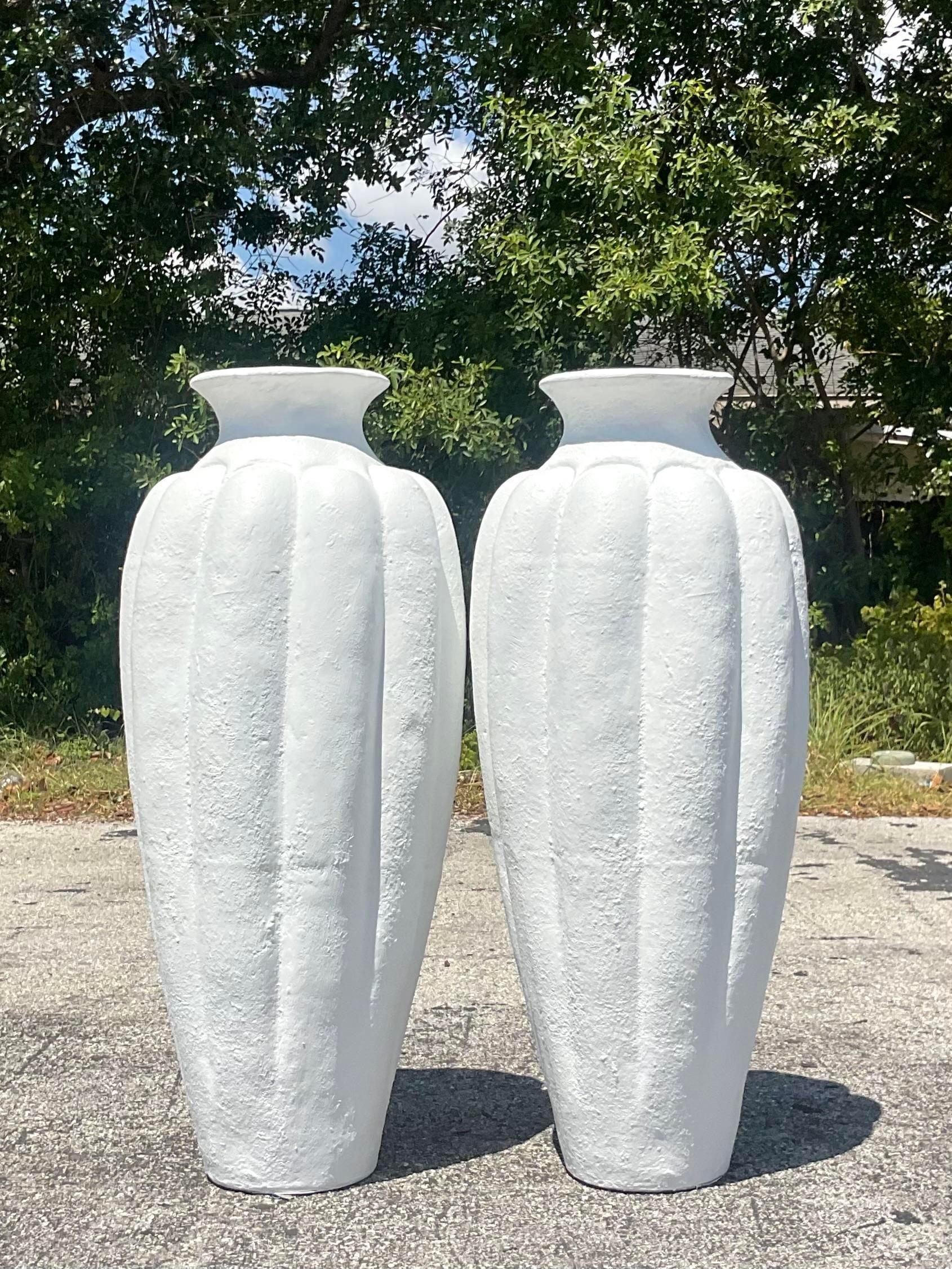 Transform your outdoor oasis with this exquisite pair of Vintage Painted Terrace Cotta Urns. With their timeless charm and classic American appeal, these urns bring a touch of old-world elegance to any garden or patio, creating a picturesque
