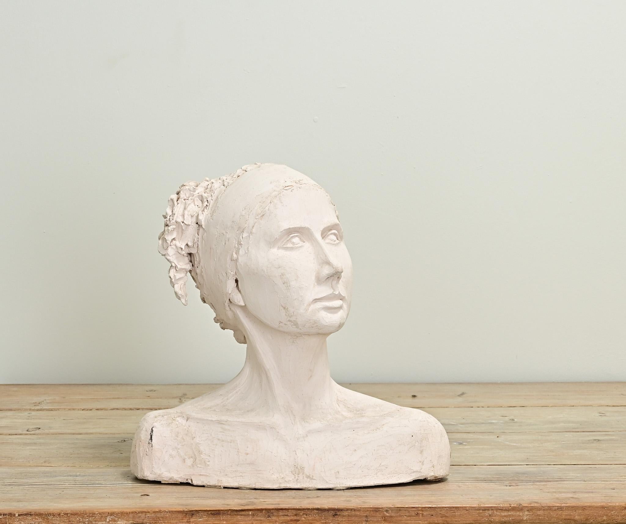 A life-like scale and replica of a lady. Impressive craftsmanship and details can be found on this bust made of plaster. Be sure to view all the details from every angle.