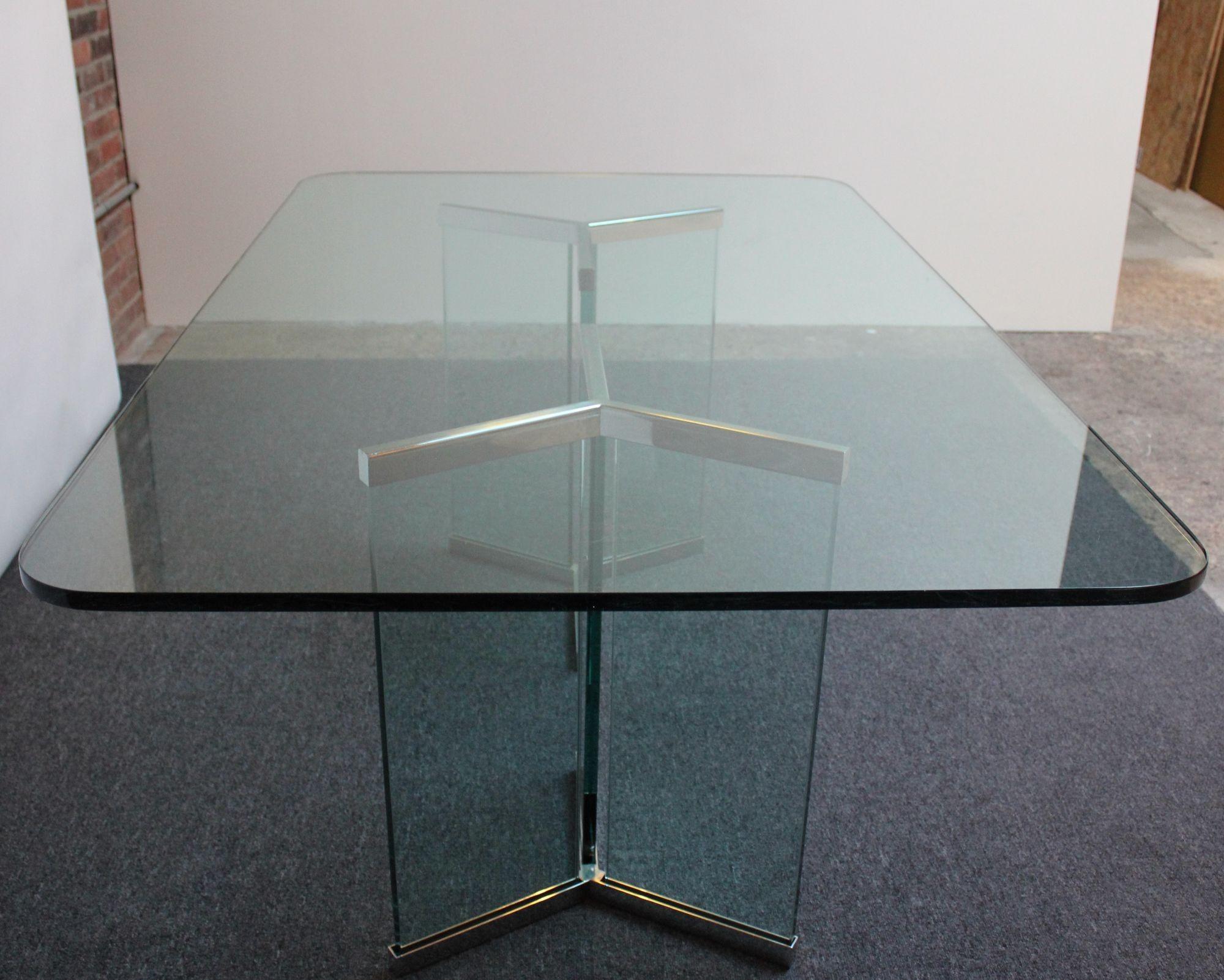 Stylish and sophisticated dining table (model 6060) designed by Leon Rosen for the Pace Collection composed of a heavy plate-glass 72