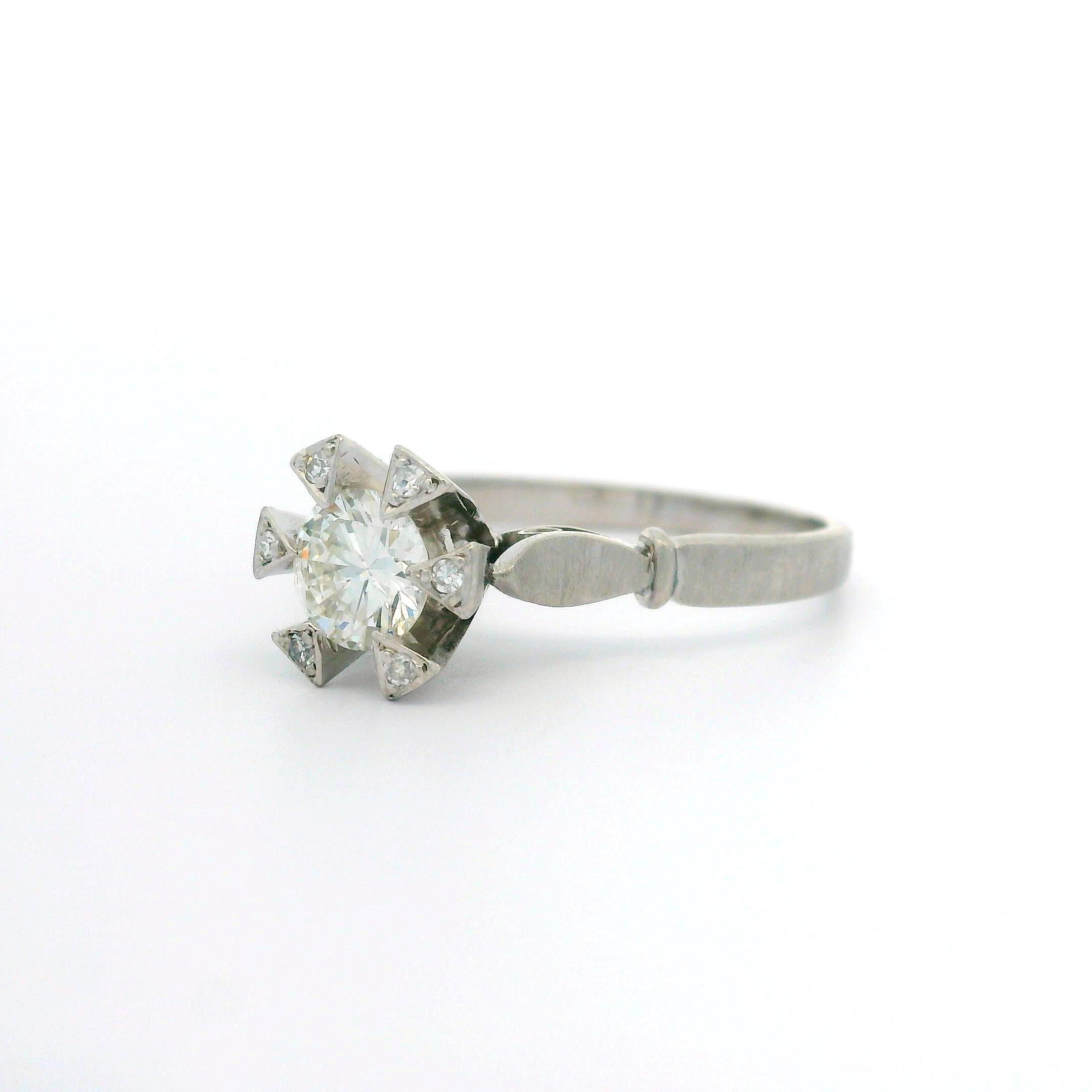 Vintage Platinum 0.57ctw Old Diamond Triangular Prong Engagement Solitaire Ring In Excellent Condition For Sale In Montclair, NJ