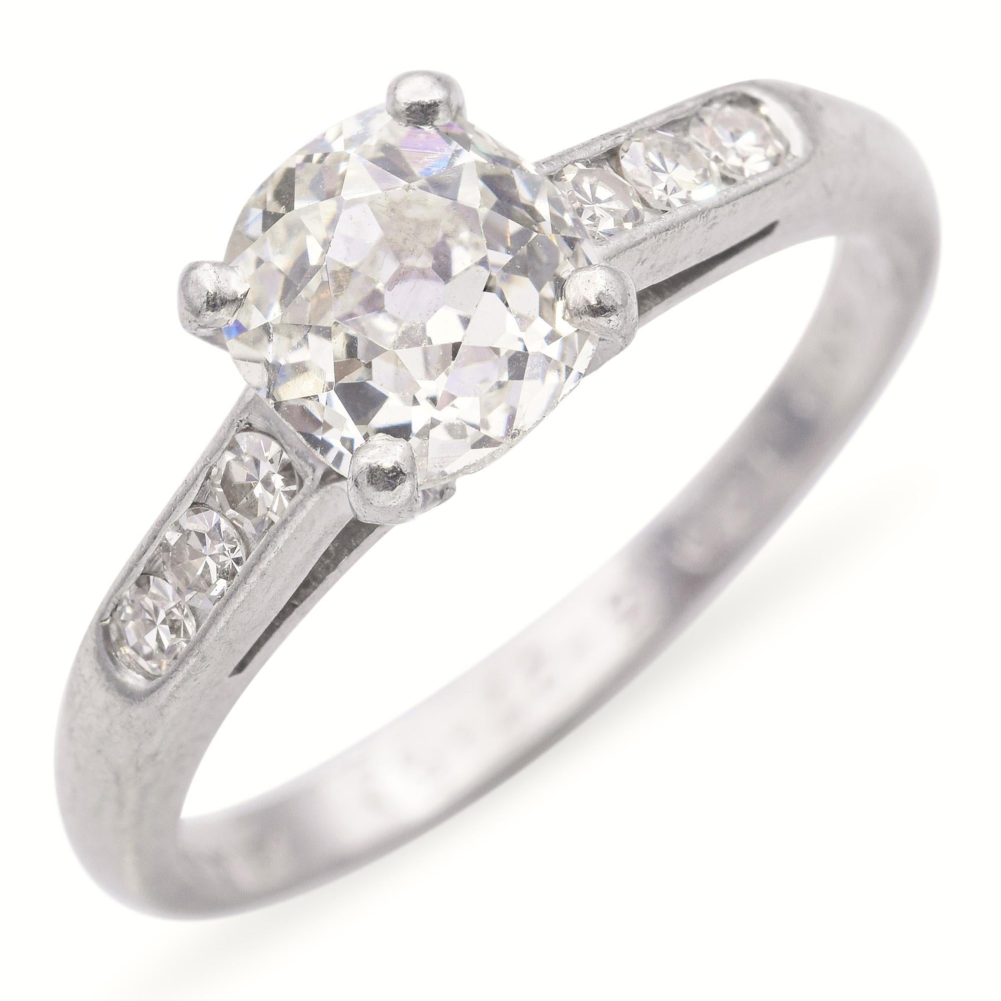 ​This exquisite 1950's engagement ring showcases a 0.96-carat Old European cut diamond, renowned for its vintage charm and exceptional brilliance. Crafted in platinum, the ring features intricate milgrain detailing and geometric accents. The