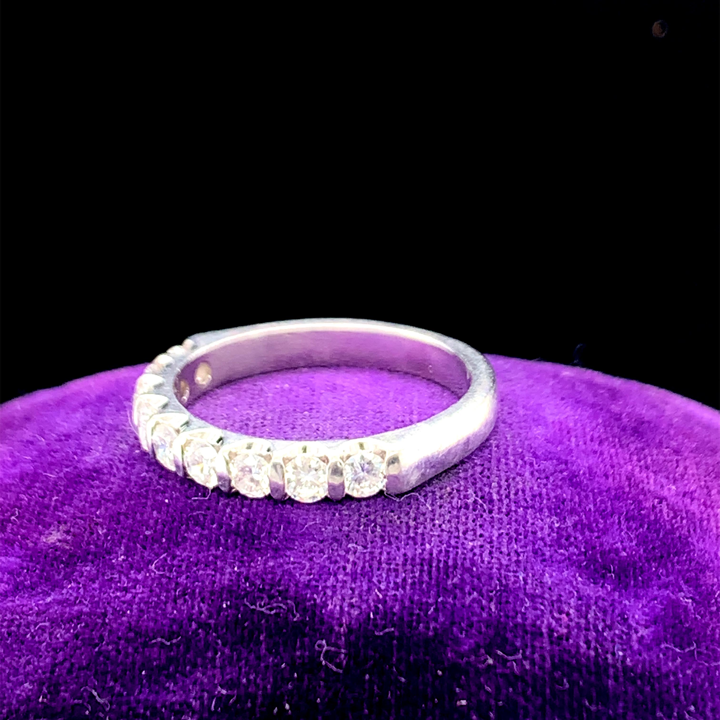 Year: 1960s

Item Details: 
Ring Size: 7.25
Metal Type: Platinum  [Hallmarked, and Tested]
Weight:  5.8 grams

Diamond Details:
Weight: 1.00ct, total weight
Cut: Round Brilliant
Color: F-G
Clarity: VS/SI

Finger to Top of Stone Measurement: