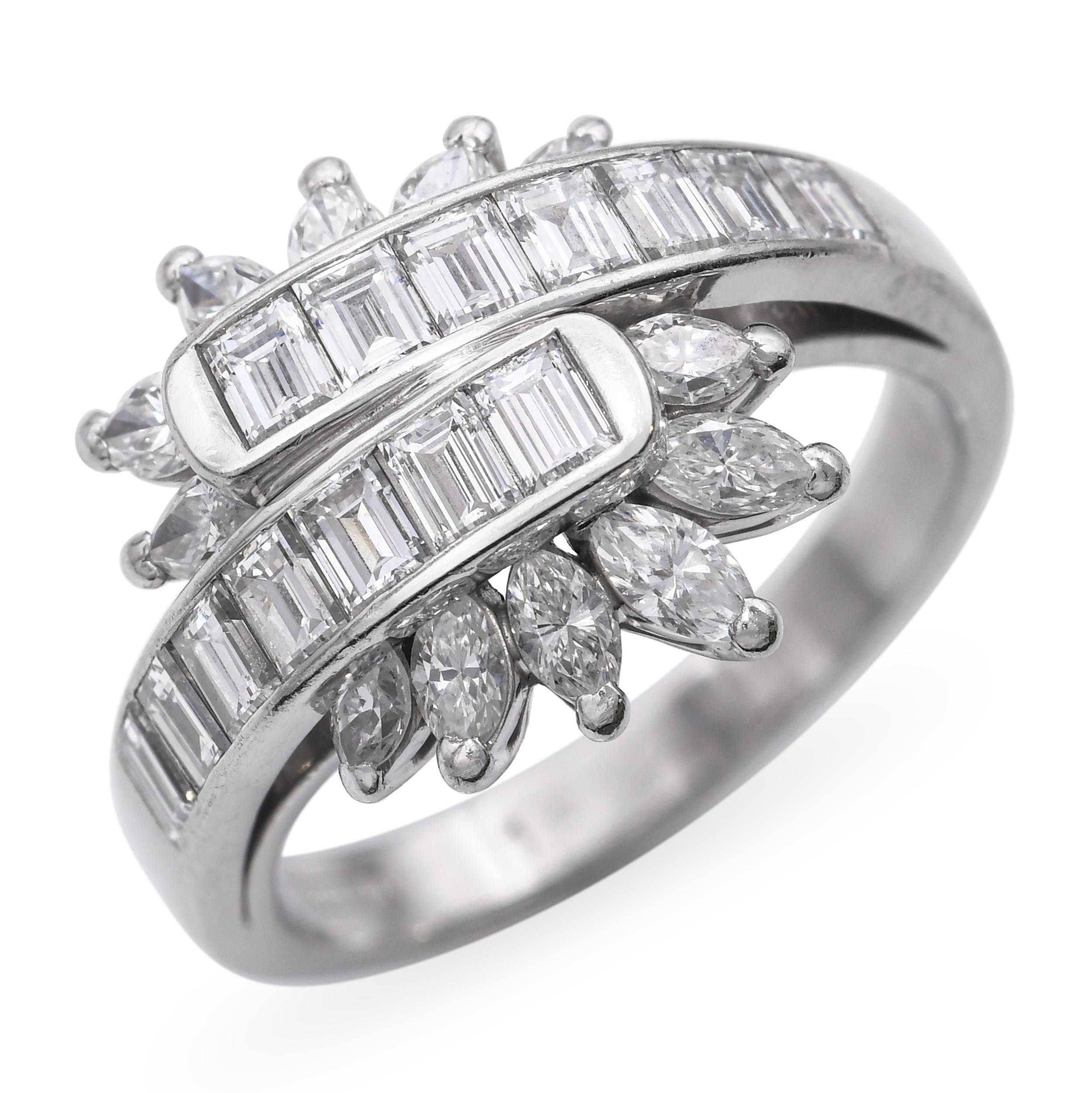 This unique vintage ring is crafted in platinum and features a semi-bypass design accented with 1.02 carats of sparkling diamonds. The shoulders and shank showcase a geometric arrangement of sleek baguette diamonds, adding a modern architectural