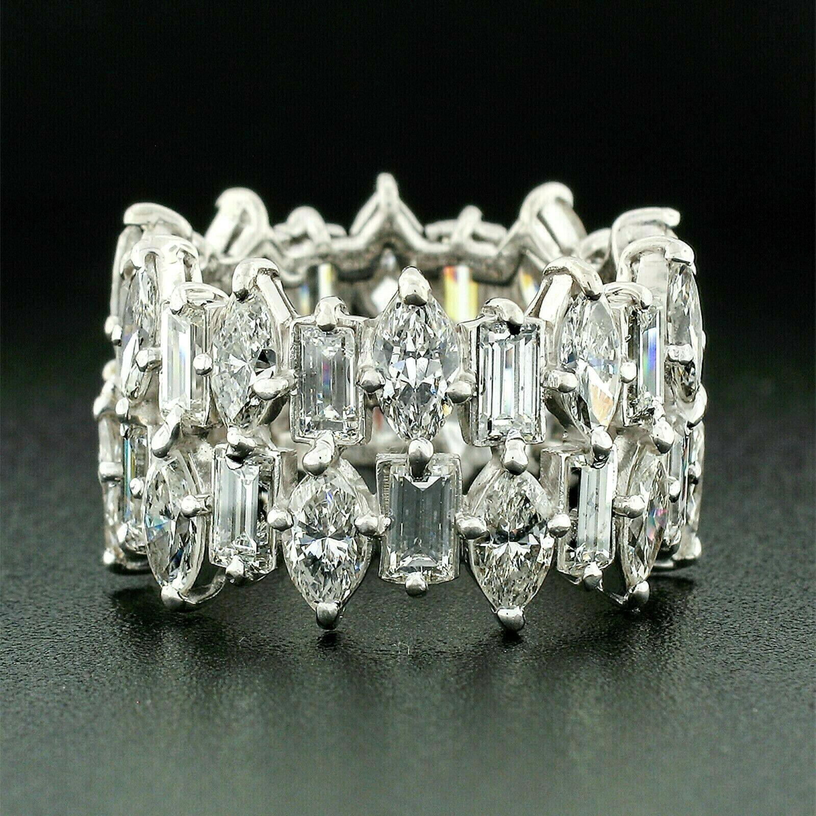 Here we have a truly spectacular vintage diamond eternity band that was crafted from solid .950 platinum. It features 40 very fine quality marquise and straight baguette cut diamonds that alternate in two rows throughout the eternity design. The