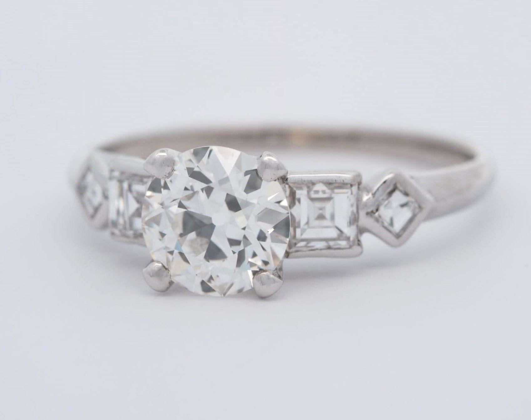 Own a piece of history with this beautiful vintage platinum engagement ring. Featuring a stunning 1.12 ct old European cut diamond, this ring is sure to make a statement. The round diamond is prong-set in a platinum band, showcasing the natural