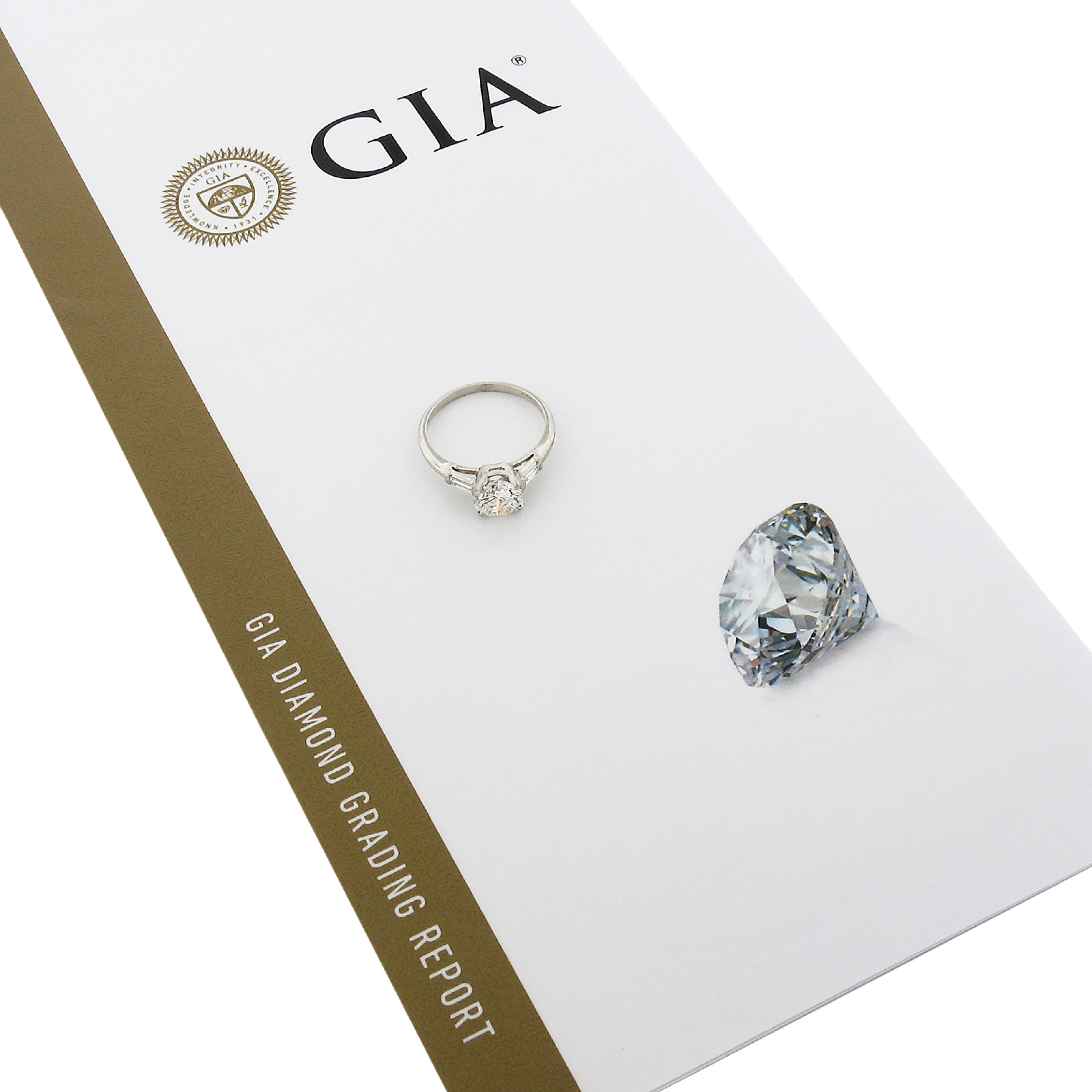 You are looking at a breathtaking, vintage, engagement style ring that was crafted from solid platinum. It features an absolutely incredible, GIA certified, round brilliant cut diamond solitaire neatly set with sturdy prongs at its center and is