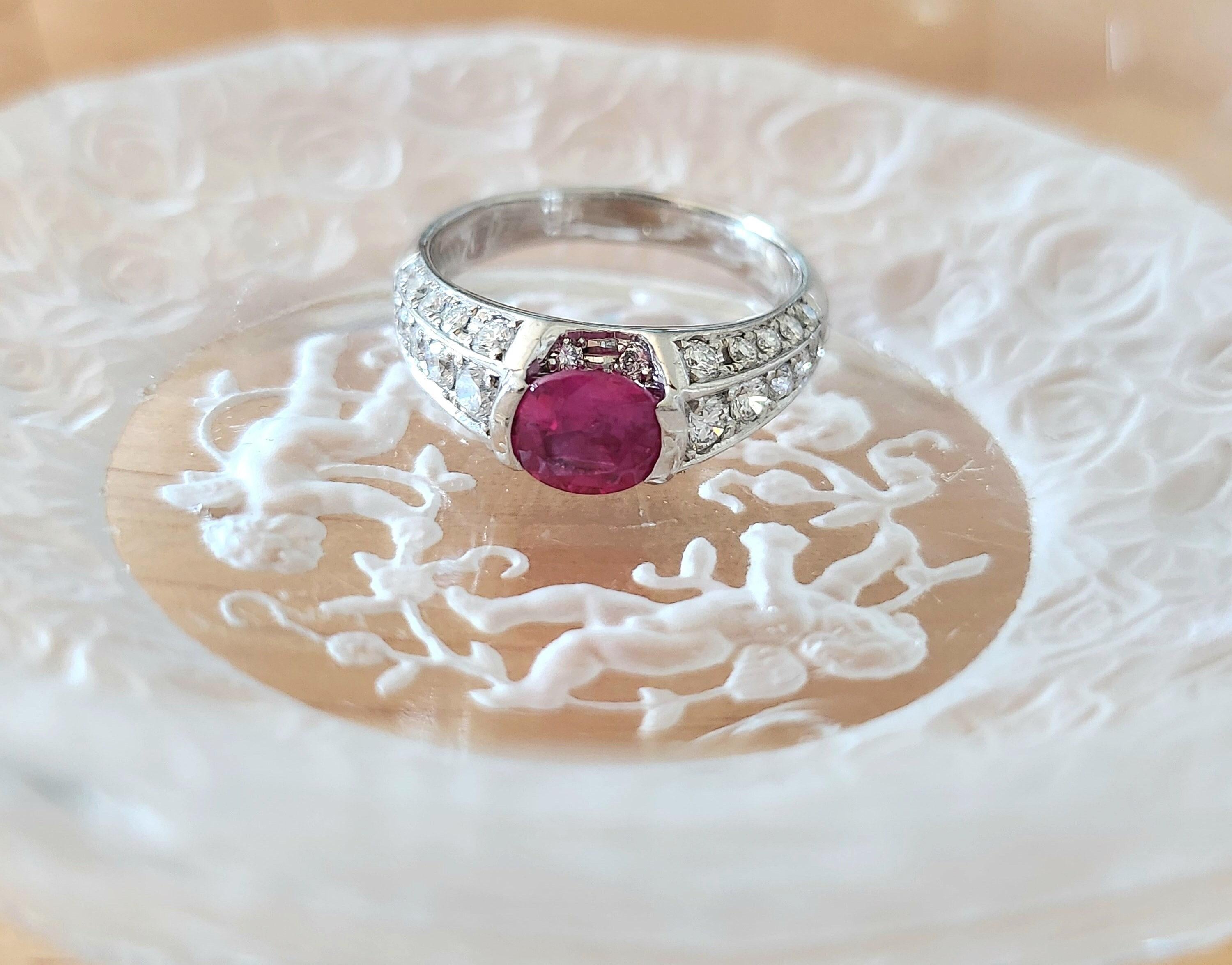 This is a stunning Burmese ruby and diamond ring. Known for producing the finest rubies in the world, Burma (Myanmar) delivers once again with this delightful pinkish-red gemstone. Paired with an exquisite platinum setting, this piece is a true