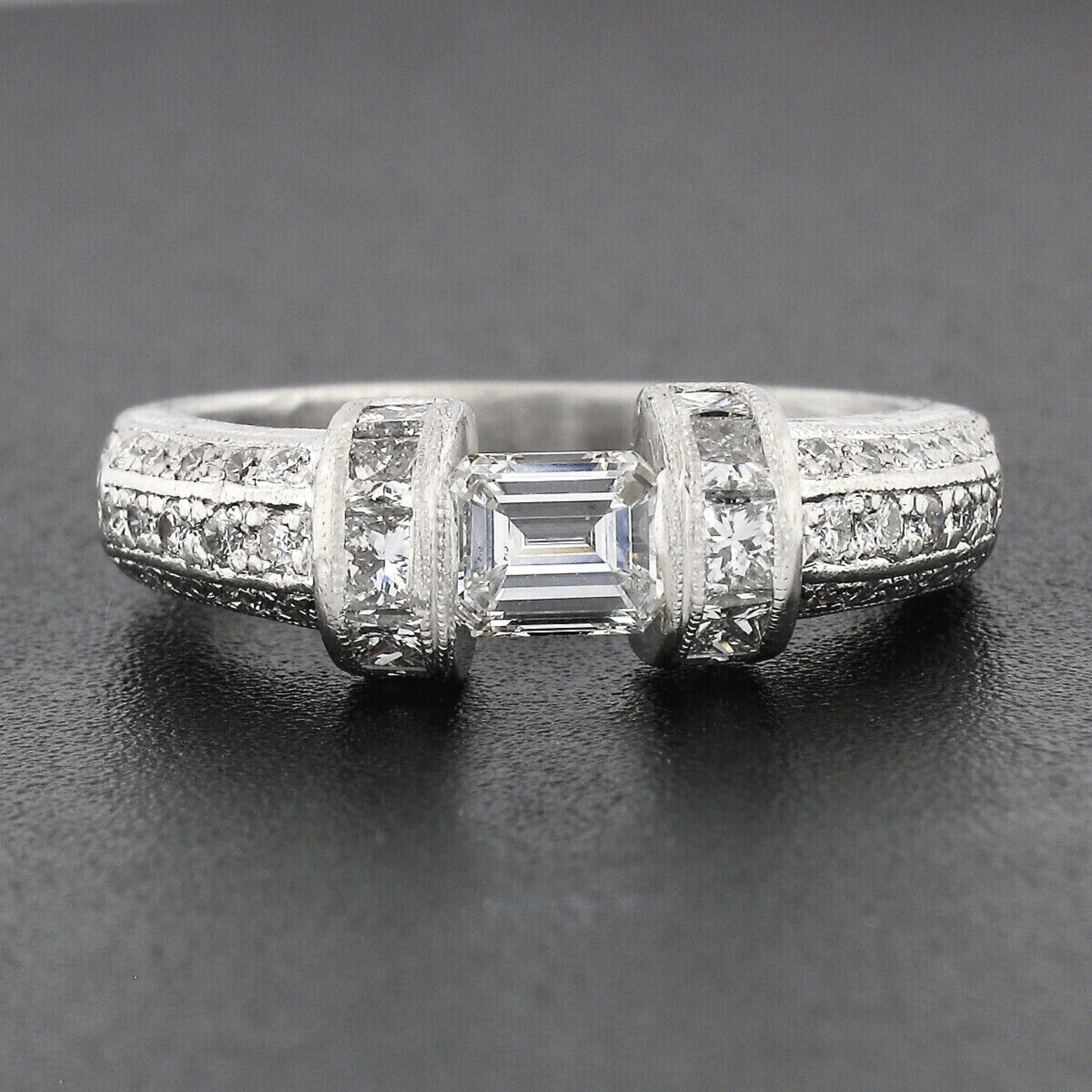You are looking at a stunning vintage band ring crafted from .900 solid platinum featuring an absolutely incredible floating diamond at its center. This fine quality emerald cut diamond is tension set creating the floating illusion seen from the