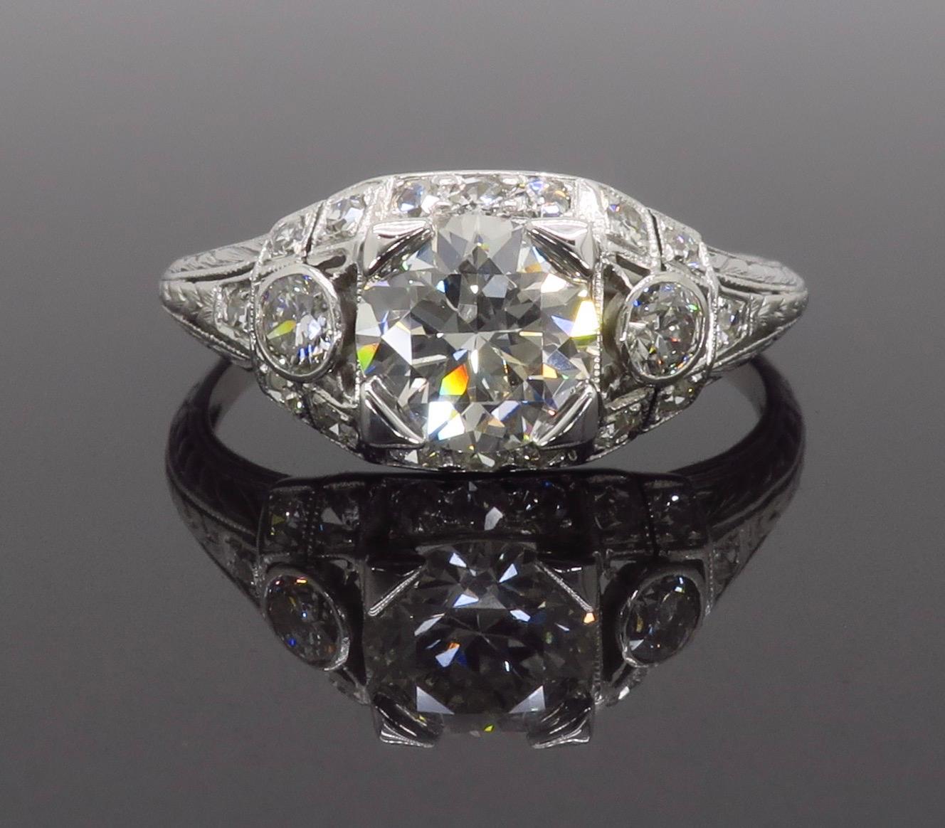 Vintage approximately 1.40CTW diamond ring crafted in platinum with a 14k white gold shank.

Center Diamond Carat Weight: Approximately 1.00CT
Center Diamond Cut: Transitional Cut
Center Diamond Color: H
Center Diamond Clarity: VS2
Total Diamond