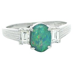 Vintage Platinum 1.43ctw GIA Oval Boulder Opal w/ Step Cut Diamond Sides Ring