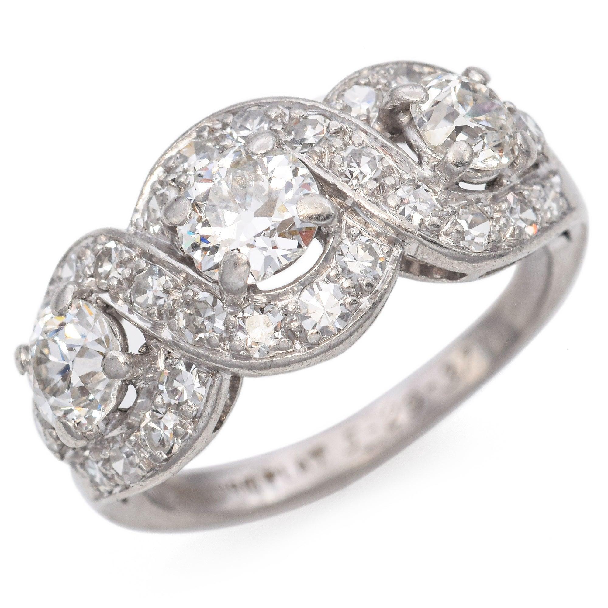 This captivating piece, set in platinum, features a harmonious design with approximately 1.46 carats of white diamonds.
The intricate arrangement of stones creates a fluid, interwoven pattern, showcasing the brilliance of each diamond.
With its