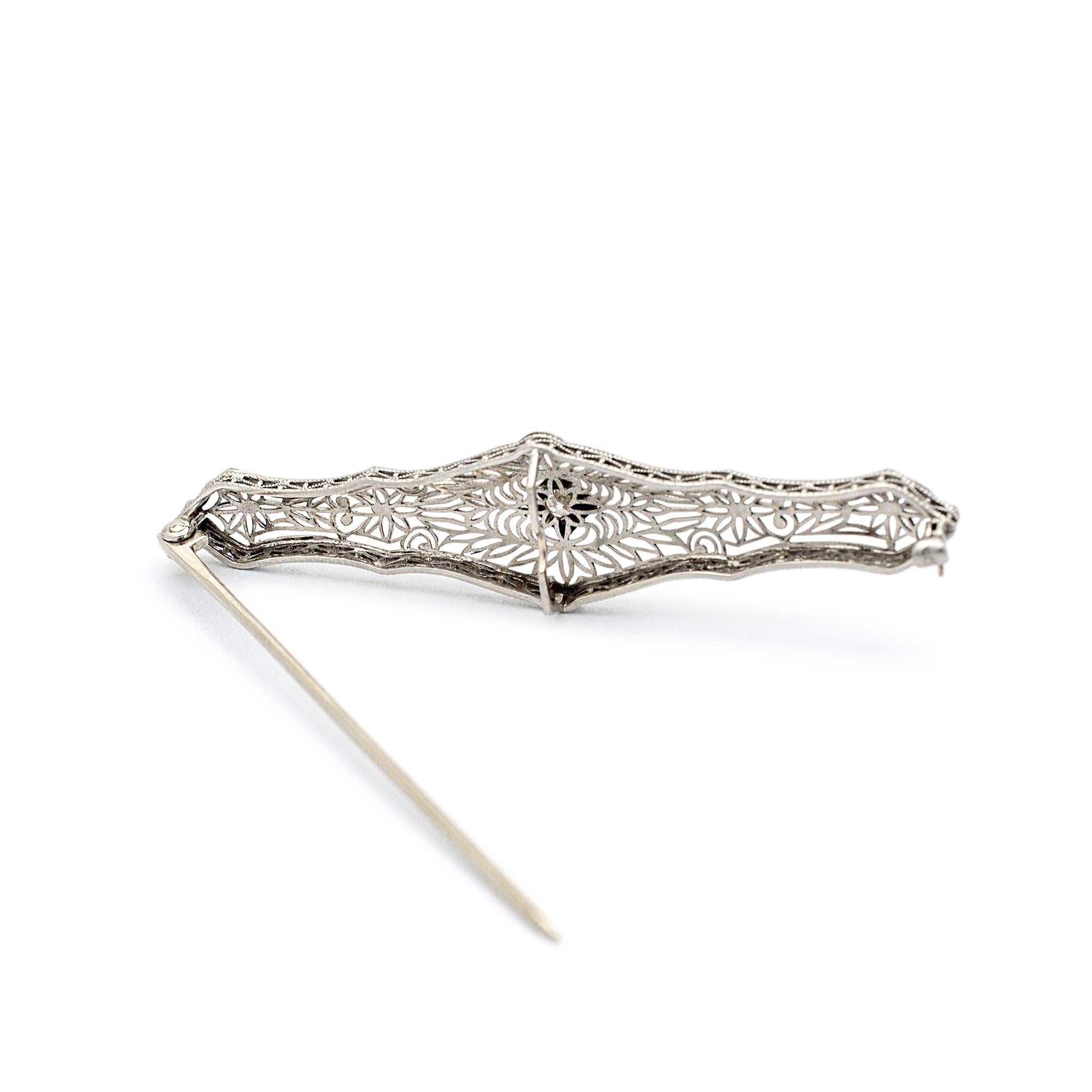 Gender: Ladies

Metal Type: Platinum & 14K White Gold 

Length: 2.25 inches 

Width: 14.40 mm 

Weight: 4.11 grams

Ladies 14K white gold and platinum diamond vintage brooch.  Engraved with 