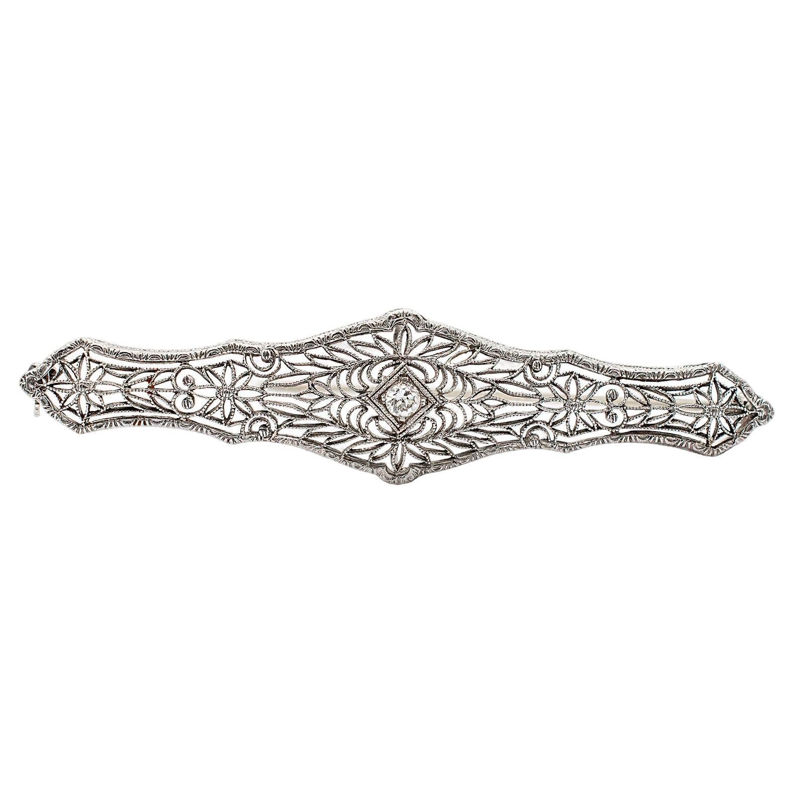 Broche vintage filigranée en platine et or blanc 14 carats