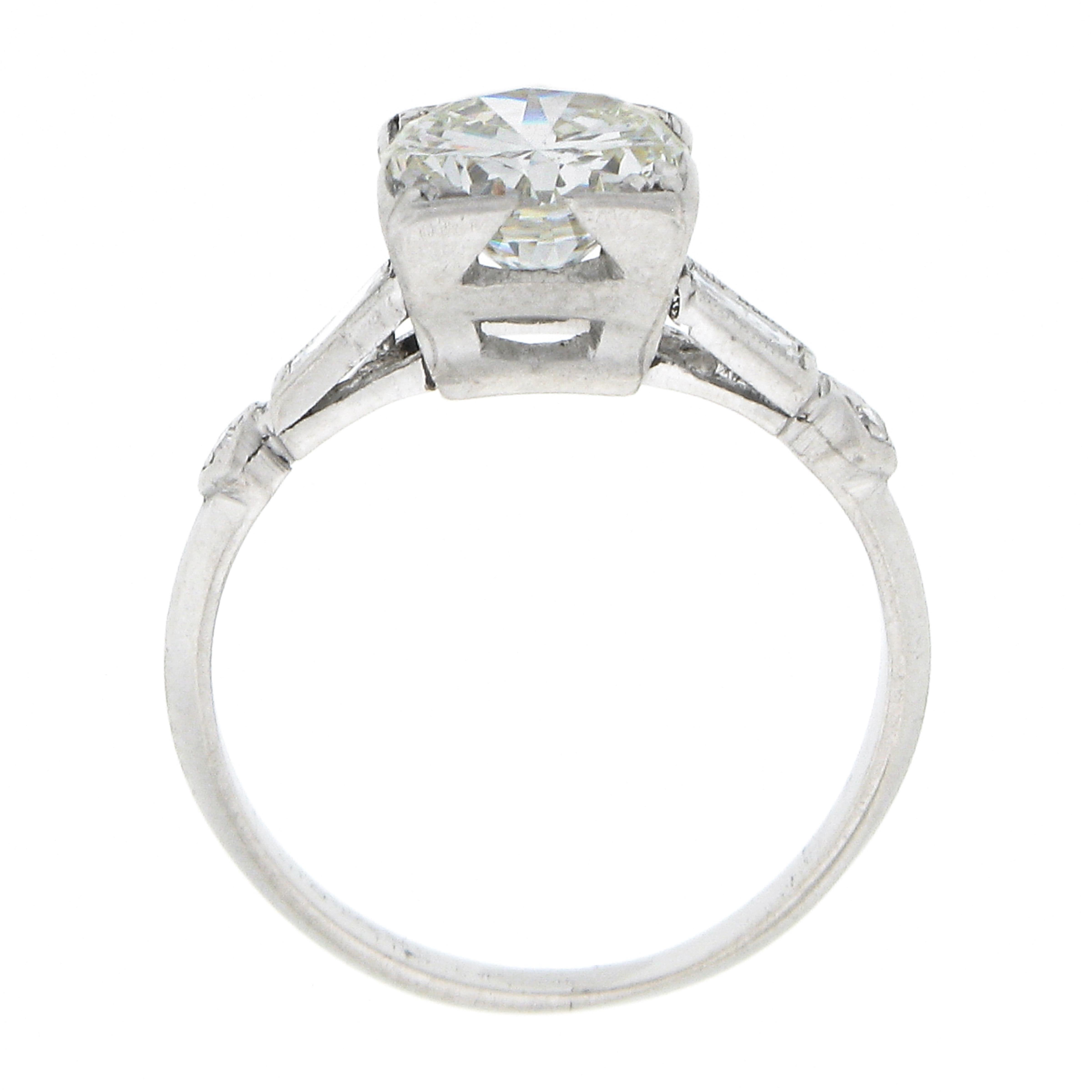 Vintage Platinum 1.50ctw Round Solitaire w/ Baguette Diamond Engagement Ring In Good Condition For Sale In Montclair, NJ