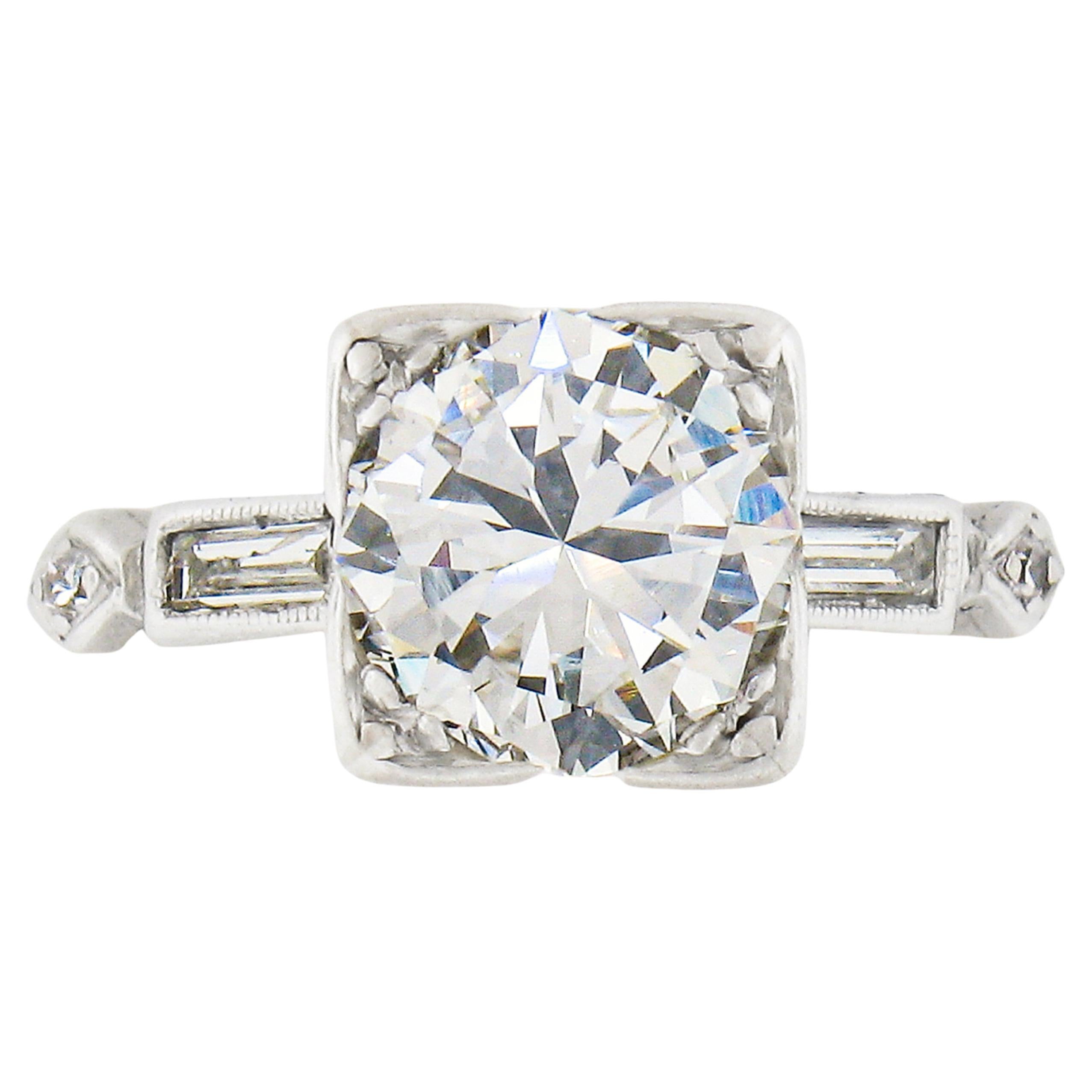 Vintage Platinum 1.50ctw Round Solitaire w/ Baguette Diamond Engagement Ring For Sale