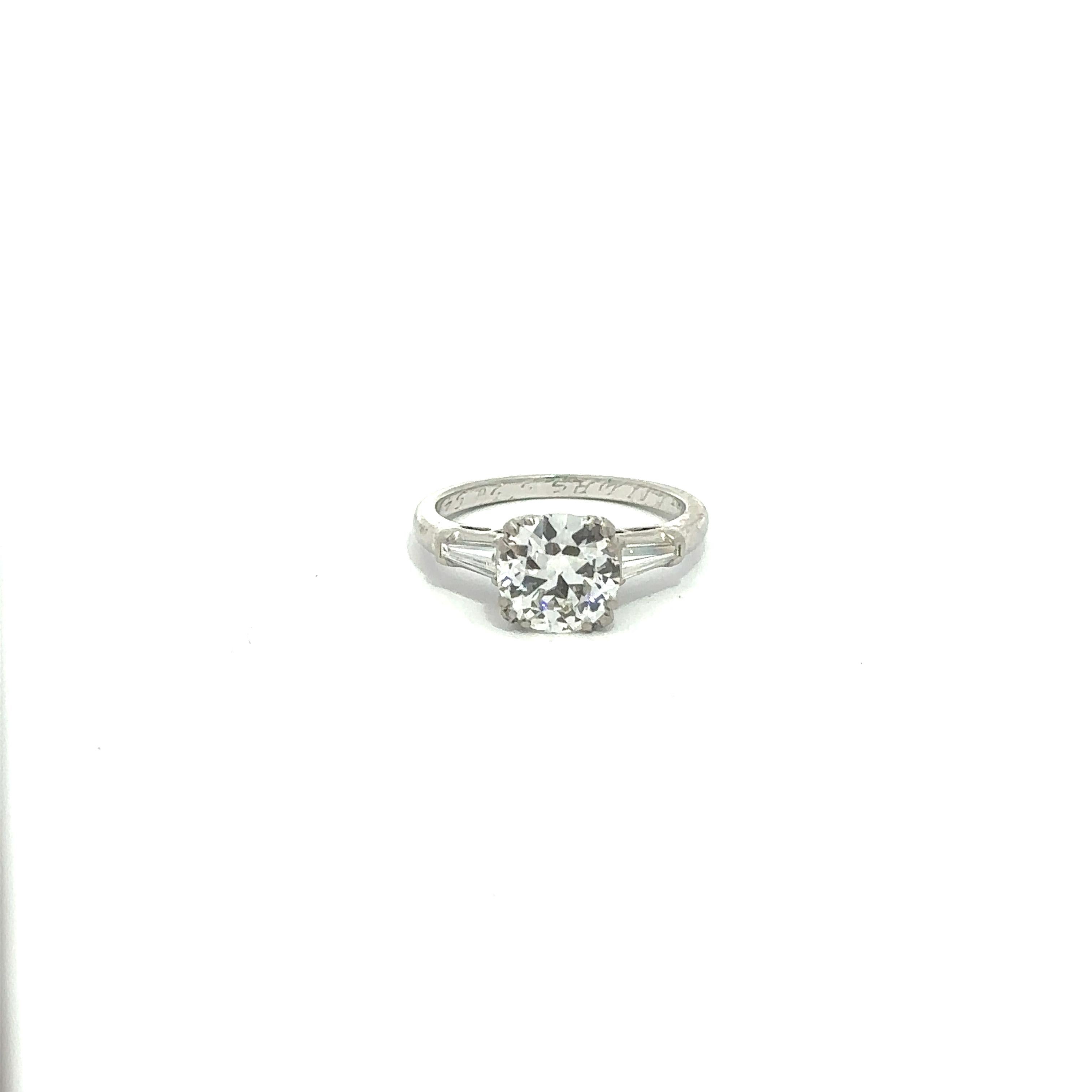 --Stone(s):--
(1) Natural Genuine Diamond - Circular Brilliant Cut - Prong Set - H Color - SI1 Clarity - 1.36ct (exact - certified)
** See Certification Details Below for Complete Info **
(2) Natural Genuine Diamonds - Tapered Baguette Cut - Channel