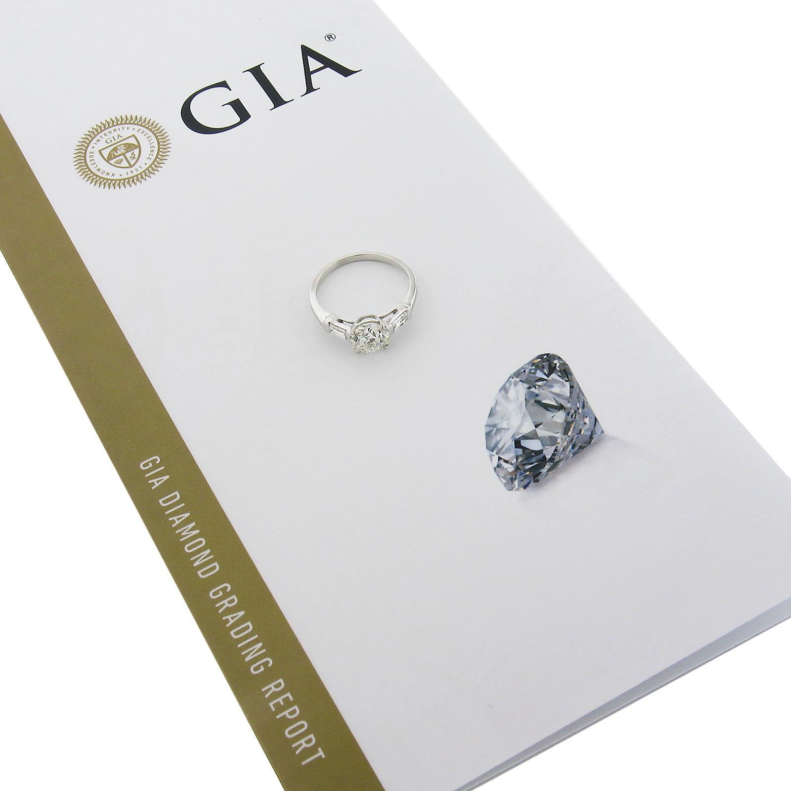 --Stone(s):--
(1) Natural Genuine Diamond - Circular Brilliant Cut - Prong Set - H Color - SI2 Clarity - 1.33ct (exact - certified)
** See Certification Details Below for Complete Info **
(2) Natural Genuine Diamonds - Straight Baguette Cut -