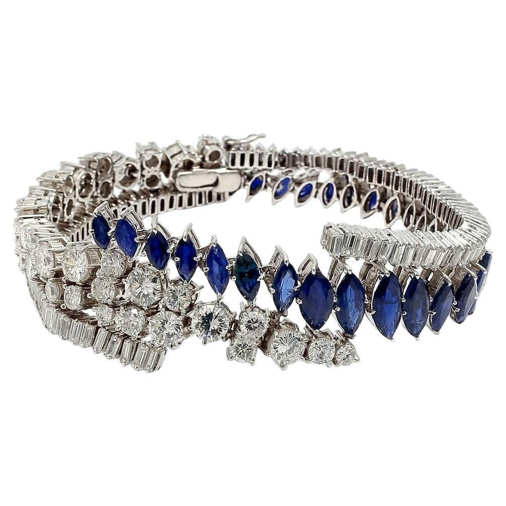 Bracelet Vintage en Platine 9.95 Carat Marquise Saphir et 9.00 Carat Diamant des années 1960

Un élégant bracelet vintage des années 1960, finement réalisé en platine et mettant en valeur un saphir taille marquise de 9,95 carats. Le saphir est