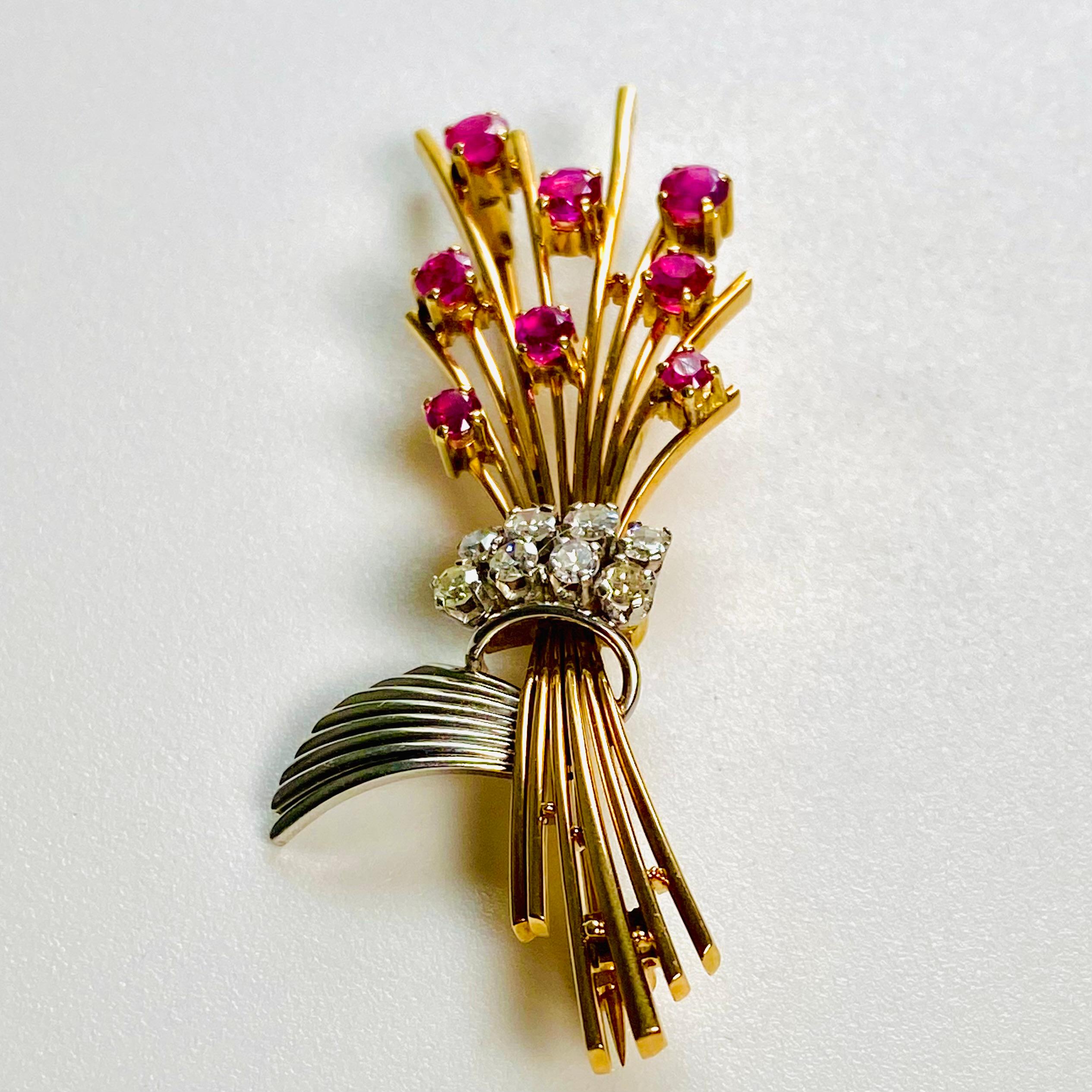 Introducing our exquisite Vintage Platinum 18 Karat Gold Foliate Brooch, adorned with 8 lustrous Rubies weighing approximately 1.00 carat and 8 Diamonds weighing approximately 0.60 carats , a timeless piece of artistry that embodies elegance and