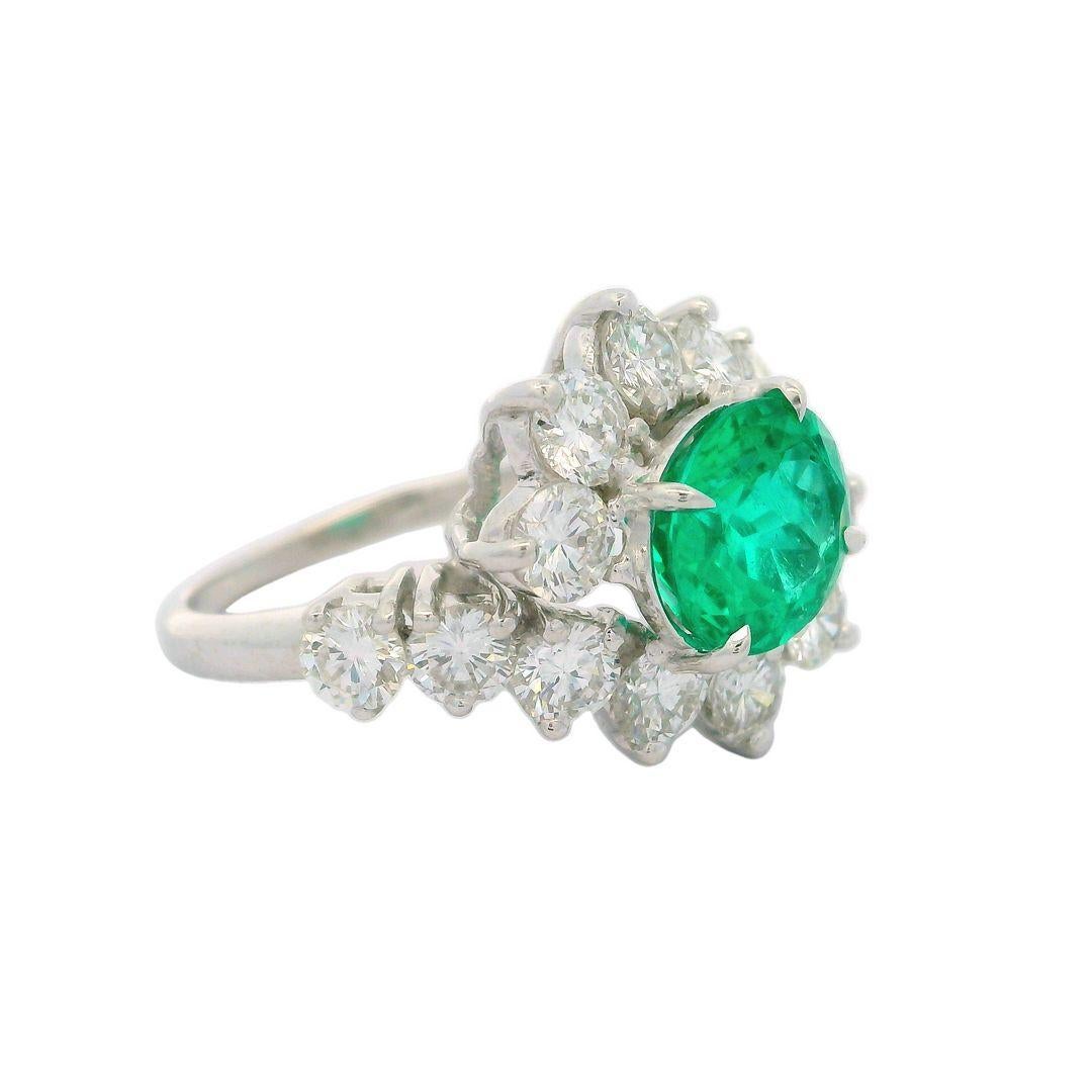 -Stone(s):--
(1) Natural Genuine Emerald - Oval Brilliant Cut - Prong Set - Amazing Brilliant Green and Cleanish for an emerald - 1.99ct (exact - certified)
** See Certification Details Below for Complete Info **
(14) Natural Genuine Diamonds -