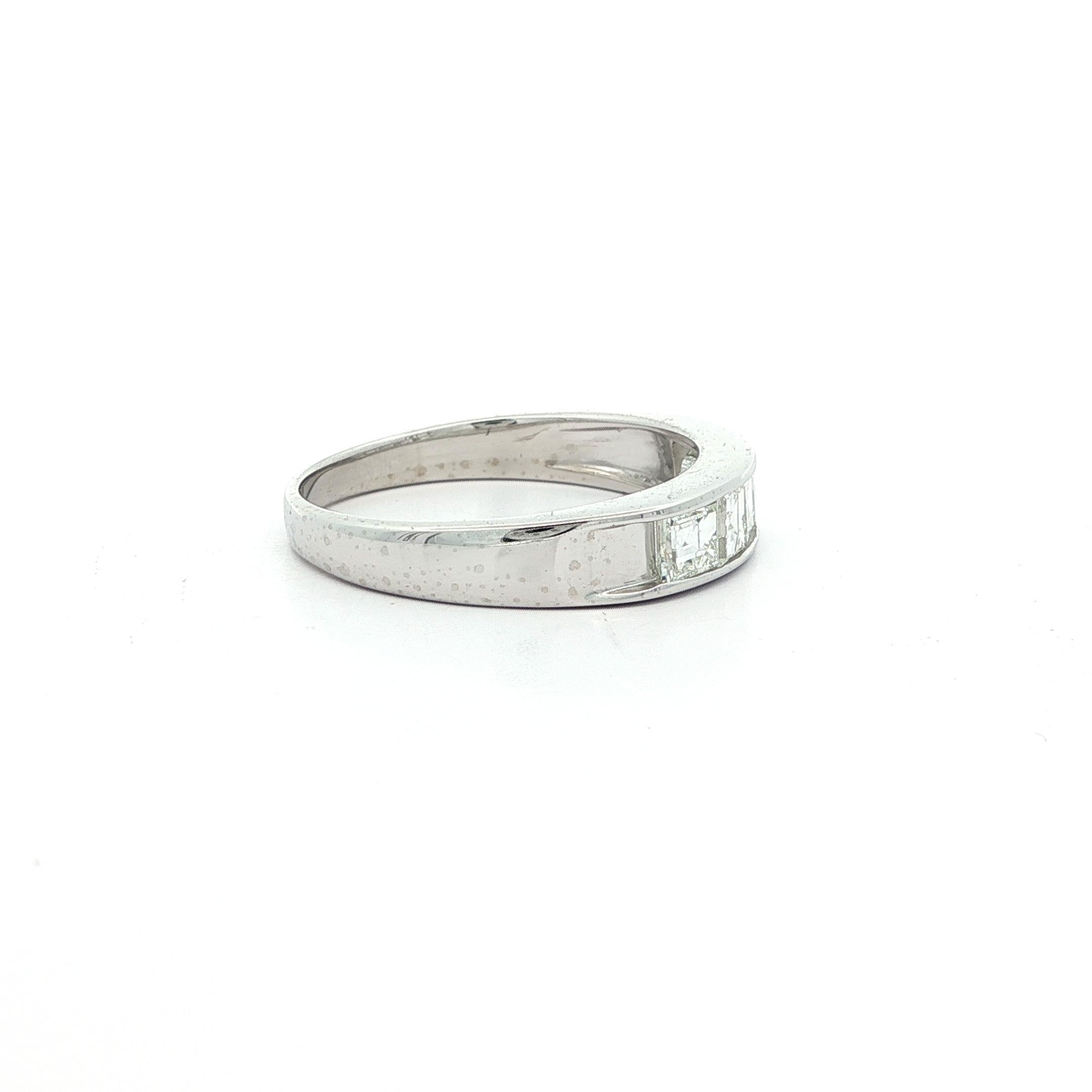 –Stone(s): –
(5) Natural Genuine Diamonds - Carré Square Step Cut - Channel Set - G/H Color - VS1/VS2 Clarity - 1.0ctw (exact)

Material: Solid .900 Platinum (tested) - Stamped PT900
Total Weight:  4.36 Grams
Size: 7.0 (Fitted on a finger, please