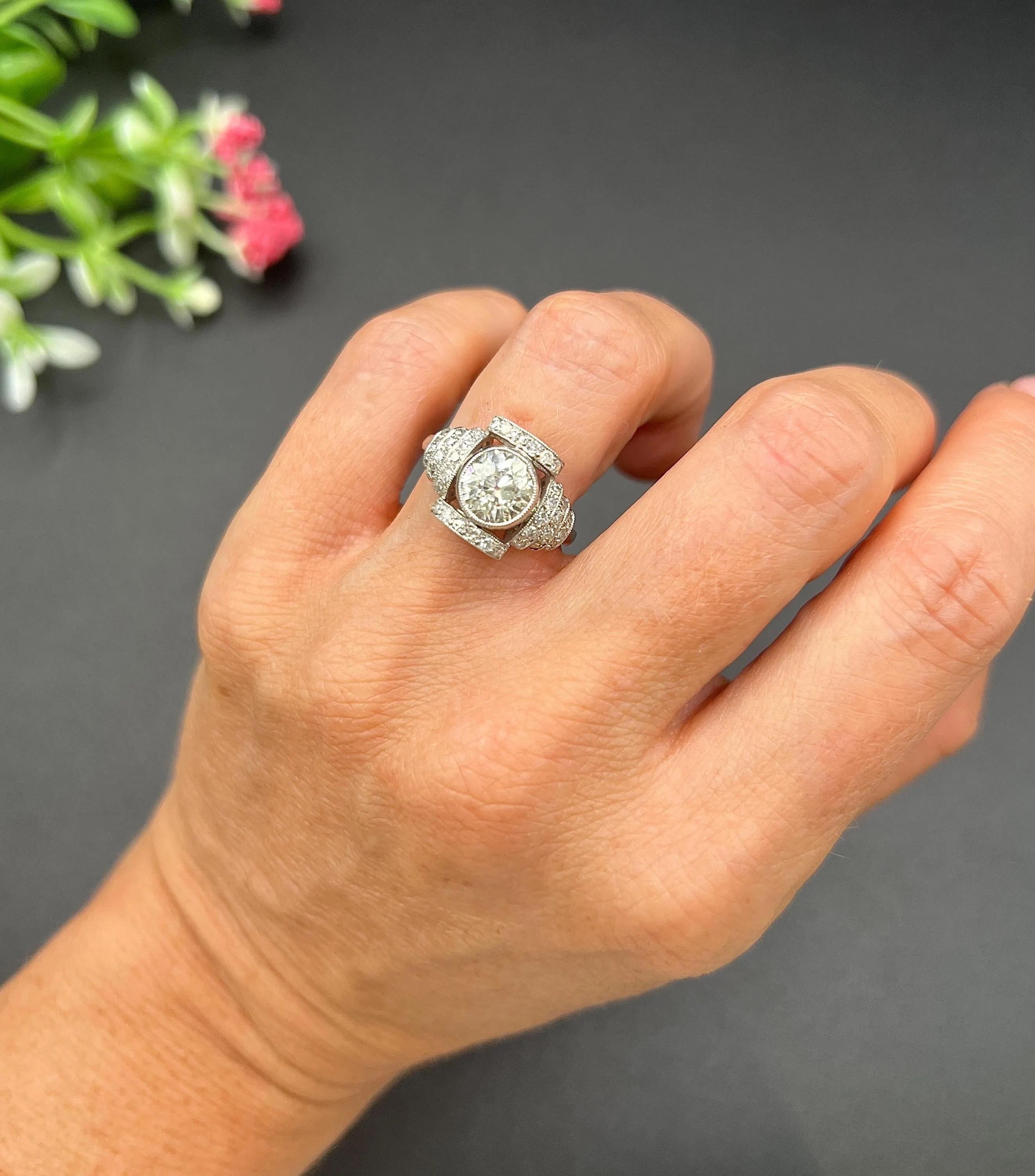 Vintage Diamond Ring

Platinum

Circa 1920s Diamond

Step back in time with this exquisite platinum Art Deco-style engagement ring, which beautifully combines vintage charm with modern elegance. At its heart lies a stunning 1.58-carat Old European