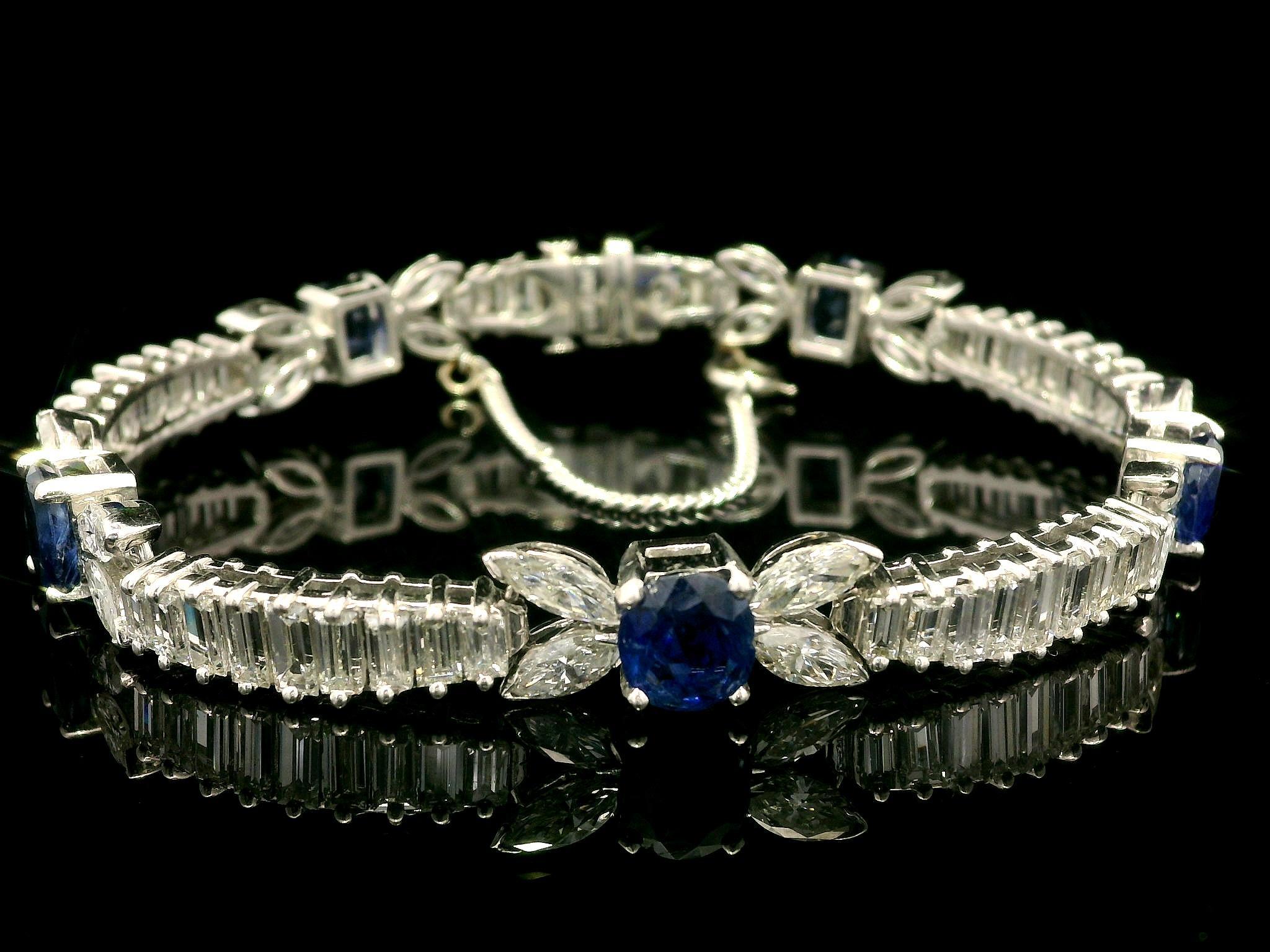 -- Stone(s) --
(20) Natural Genuine Diamonds - Marquise Cut - V Prong Set - VS1/VS2 w/ Few SI Clarity - G-I Color - 3ctw (approx.)
(45) Natural Genuine Diamonds - Baguette Cut - Prong Set - VS1/VS2 w/ Few SI Clarity - G-I Color - 10ctw (approx.)
(5)