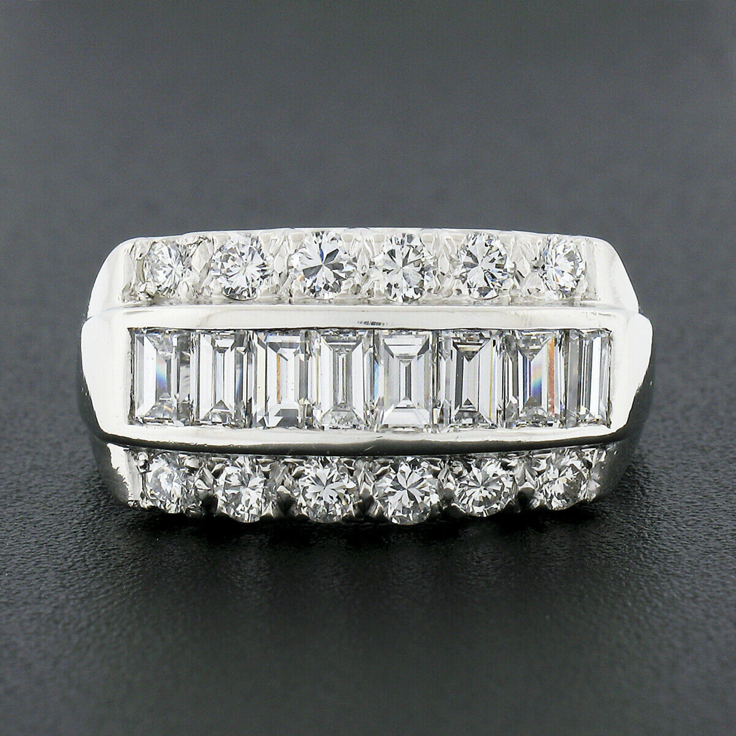 Here we have a stunning, vintage, wide band ring that is crafted from solid platinum featuring approximately 2.15 carats of very fine quality diamonds set in three rows throughout its top. The slightly domed top is neatly channel set with baguette
