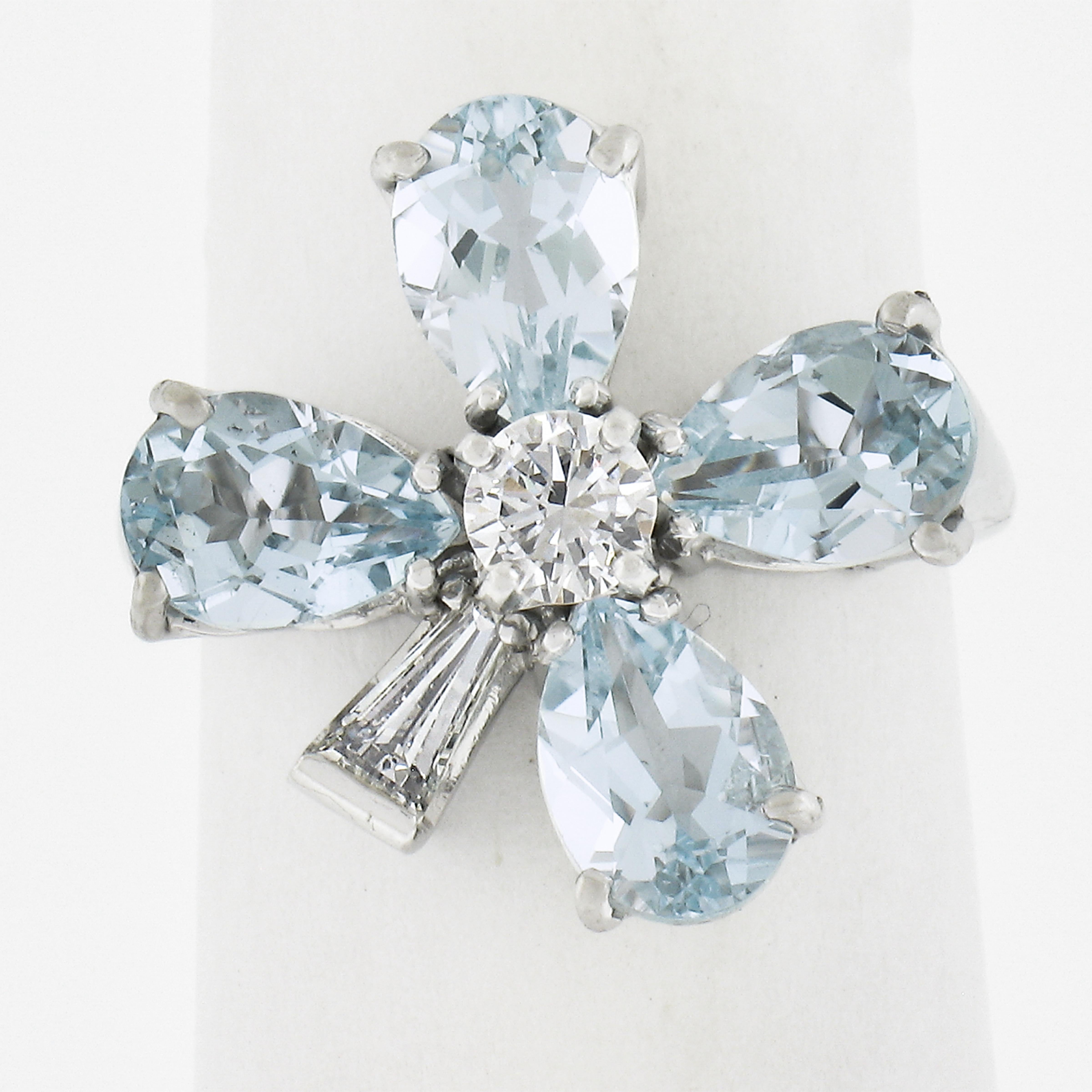 We love this ring! It is so pretty in person and the pear shaped aquamarines create a perfect 4 leaf clover stemming from a substantial center diamond - all in solid platinum! Enjoy!
--Stone(s):--
(4) Natural Genuine Aquamarine - Pear Cut - Prong