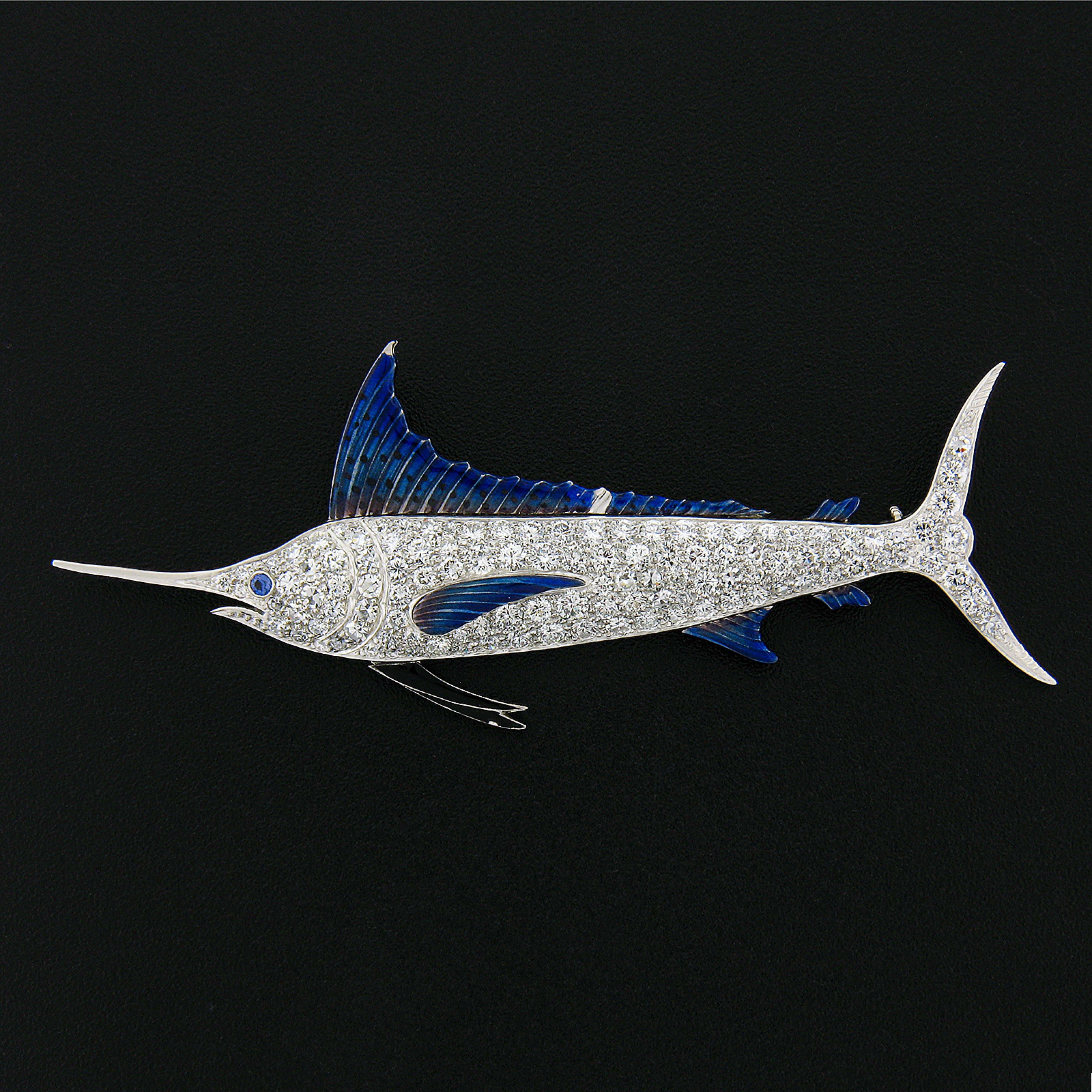 Here we have an absolutely stunning, all original, vintage brooch that was very well crafted from solid platinum. This magnificent and exceptionally well made piece features a nicely detailed swordfish design and is drenched with TOP quality
