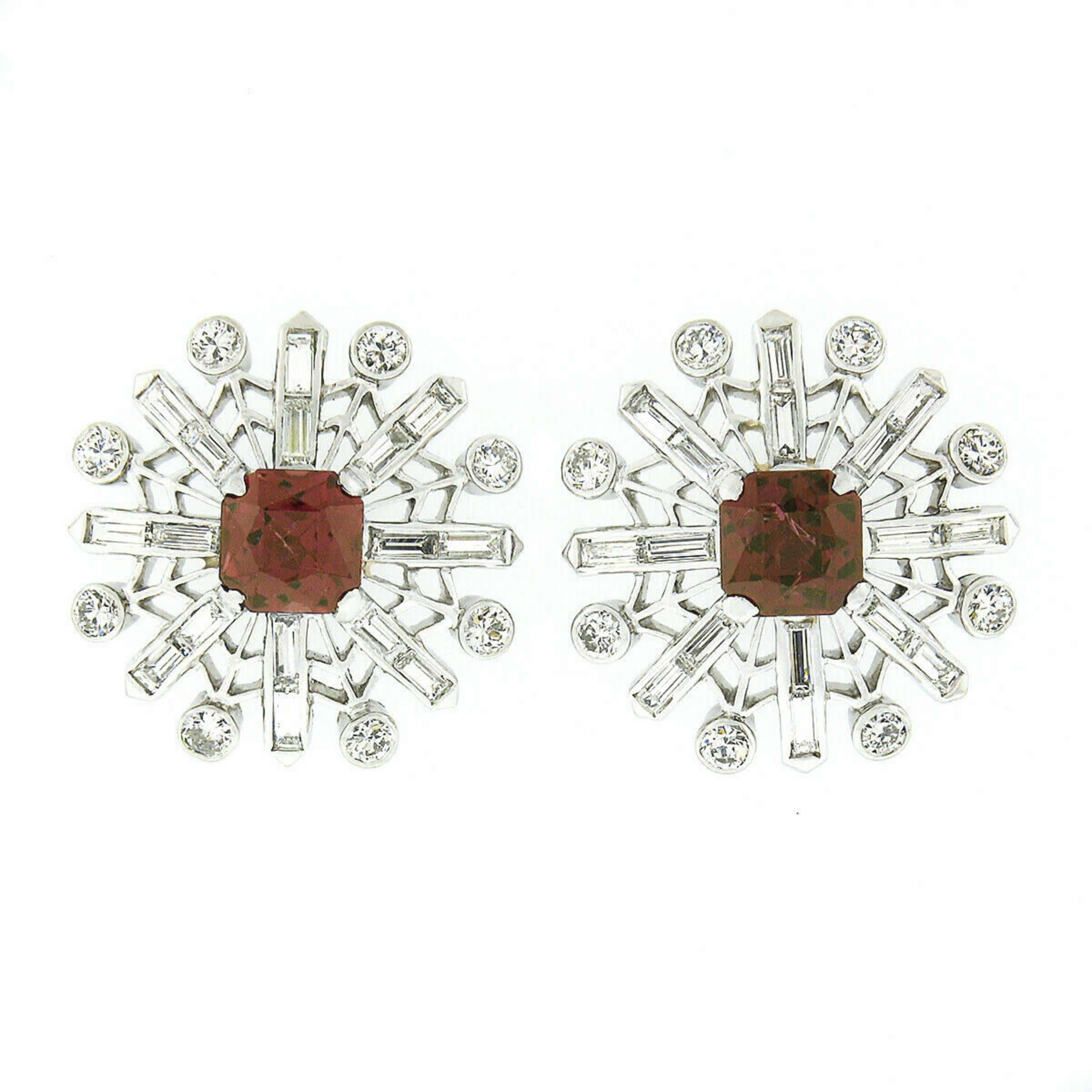 Here we have a stunning pair of vintage stud earrings that feature a lovely snowflake design crafted from solid platinum. Each earring is neatly set with a radiant cut rhodolite garnet at its center, standing out with its truly gorgeous purplish-red