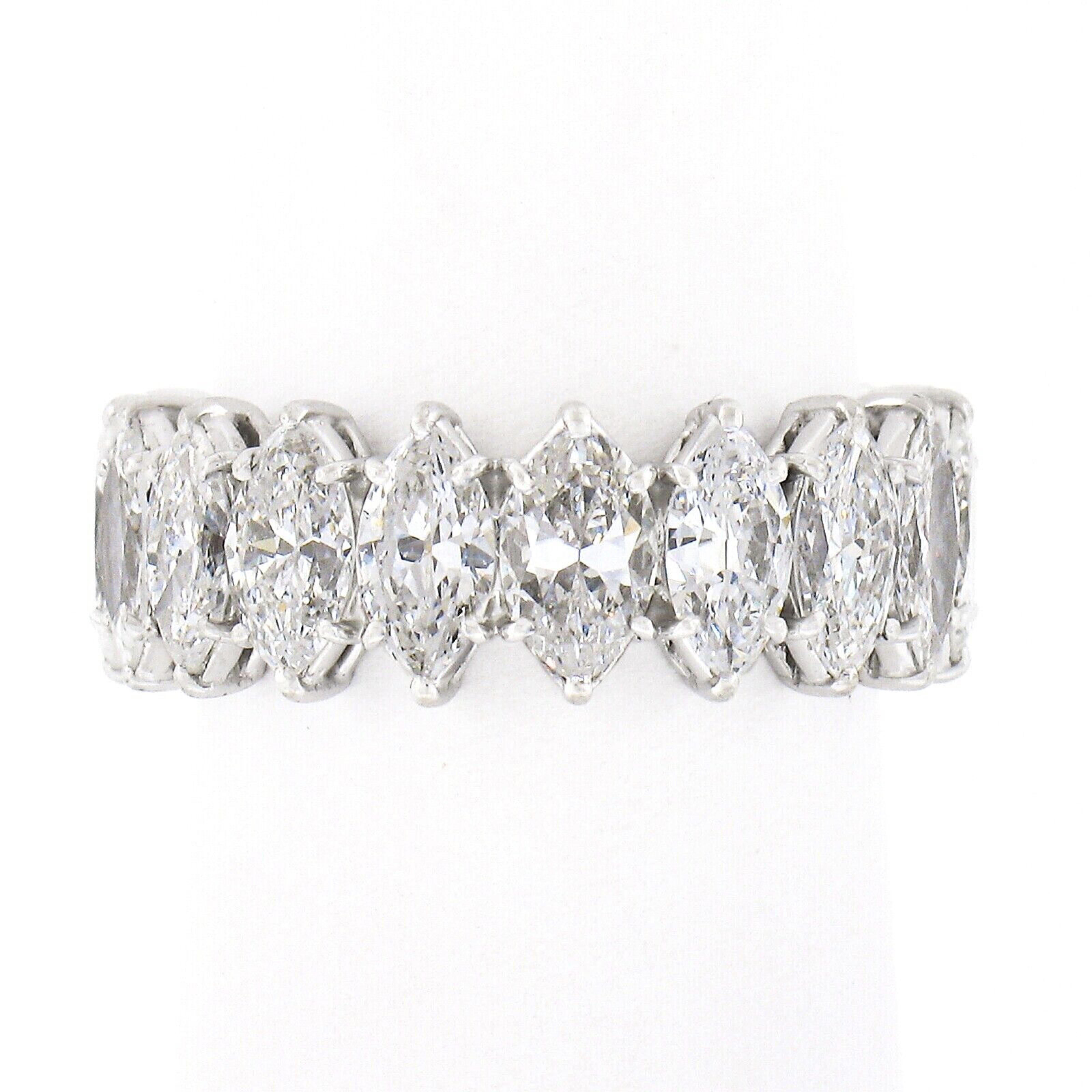 This stunning and very well made vintage diamond band was crafted from solid platinum and features a classic eternity style made from 18 marquise cut diamonds that give it a truly unique look. These stunning diamonds are neatly prong set throughout
