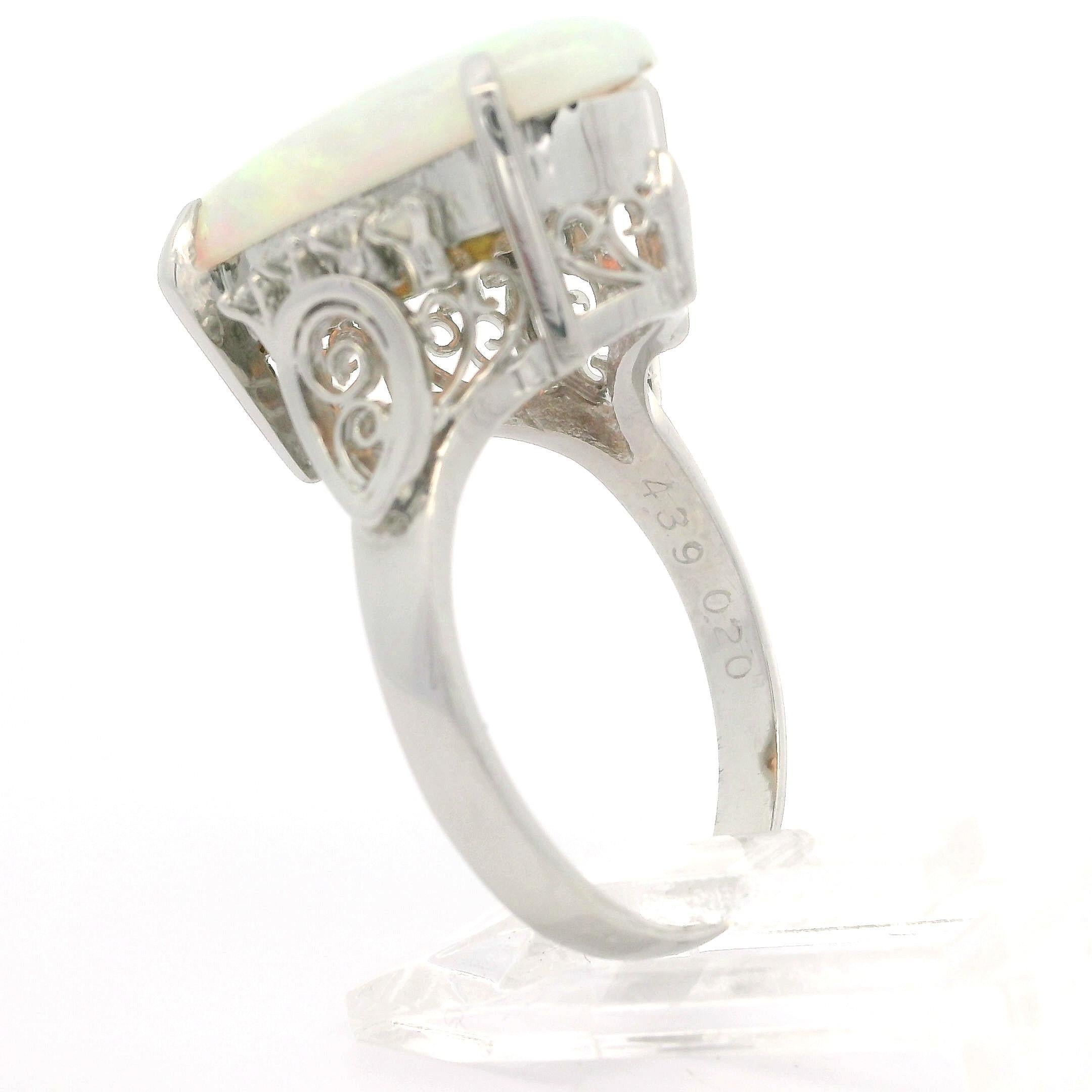 Vintage Platinum 4.59ctw Elongated Oval Opal & Diamond Cocktail Ring In Good Condition For Sale In Montclair, NJ