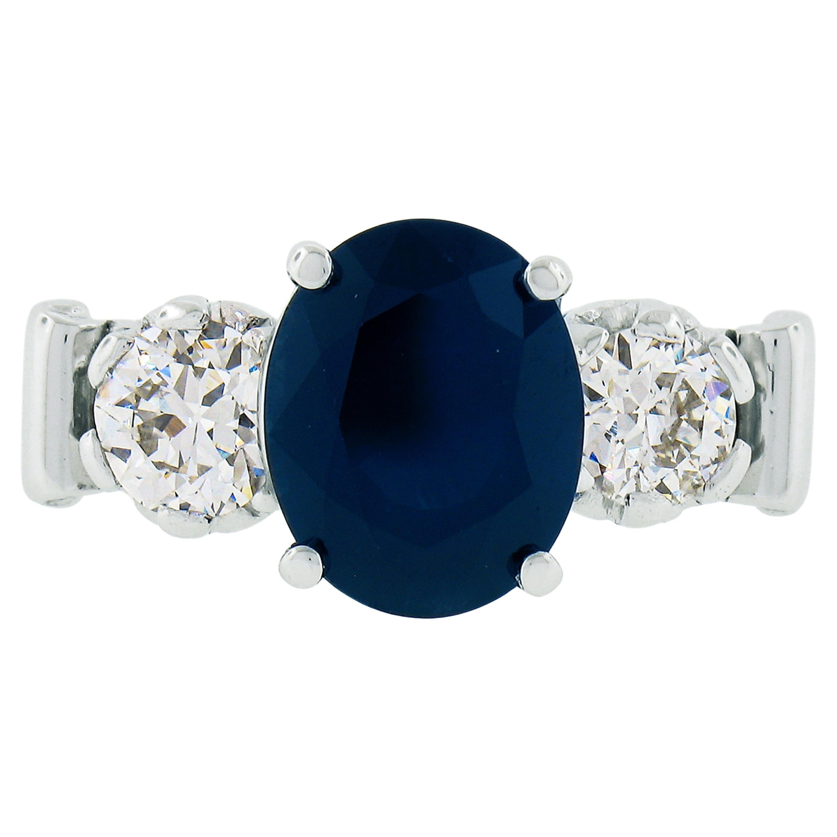 Bague vintage en platine avec saphir bleu foncé ovale de 4,95 carats certifié GIA et diamants d'Europe ancienne