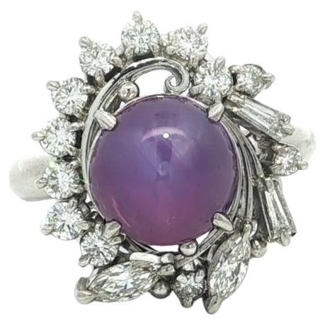 Anello vintage in platino con rubino rotondo cabochon e diamanti da 5,07 ct.