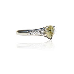 Vintage Platinum .71 Carat Fancy Light Yellow Pear Diamond Engagement Ring