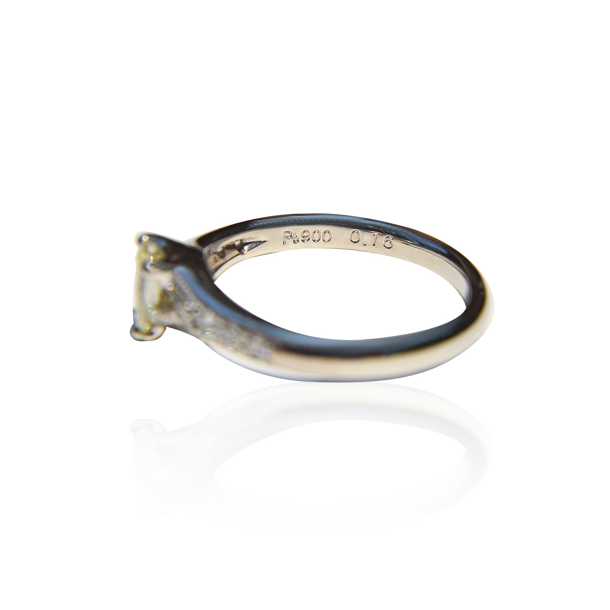Pear Cut Vintage Platinum .71 Carat Fancy Light Yellow Pear Diamond Engagement Ring For Sale