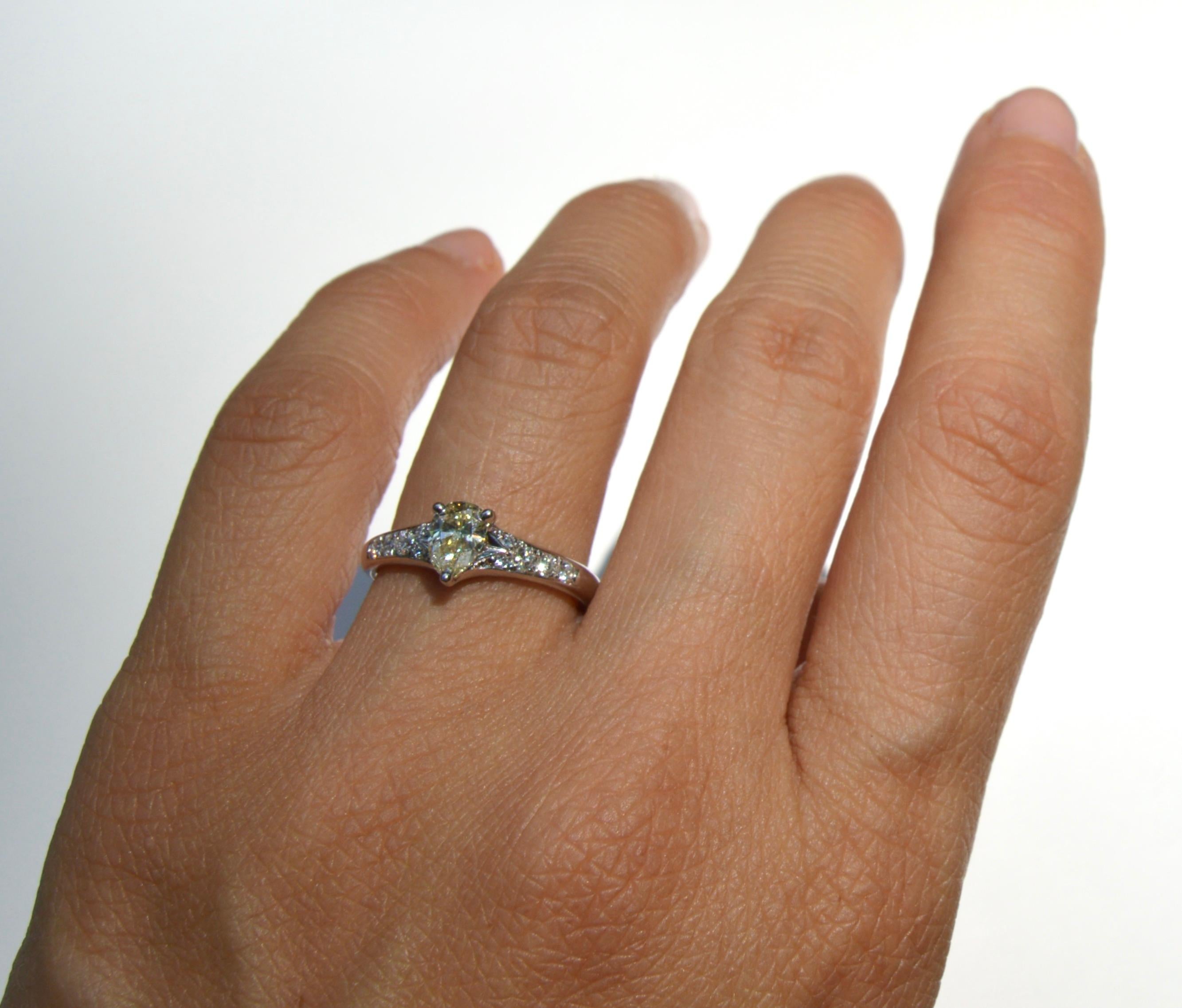 Vintage Platinum .71 Carat Fancy Light Yellow Pear Diamond Engagement Ring For Sale 1