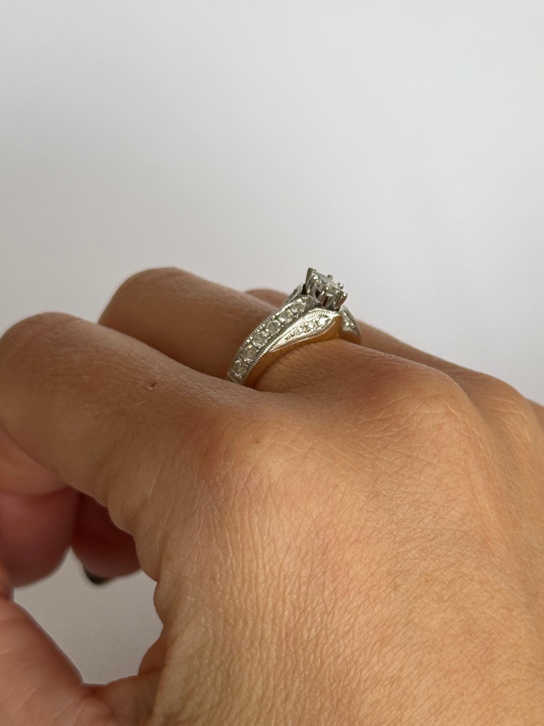 This gorgeous ring holds a 30pt marquise diamond held up high in claws. The shoulders hold larger diamonds and surrounding it are smaller diamonds. The shoulders total approx 72pts. Modelled in 14 yellow gold and stones set in platinum. On the