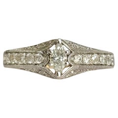 Vintage Platinum and 14 Carat Yellow Gold Marquise Diamond Solitaire