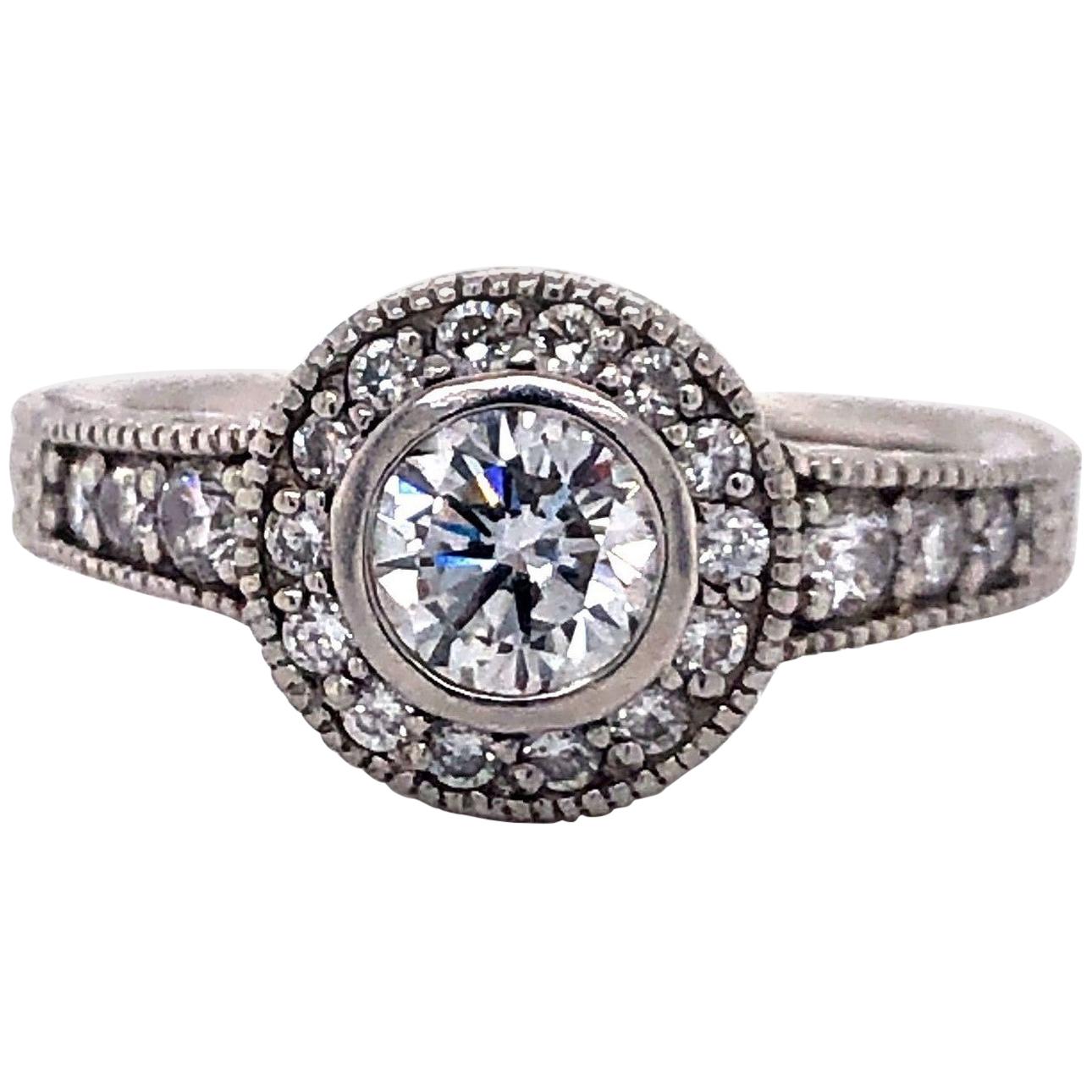 Vintage Platinum and .83 Carat Diamond Halo Engagement Ring