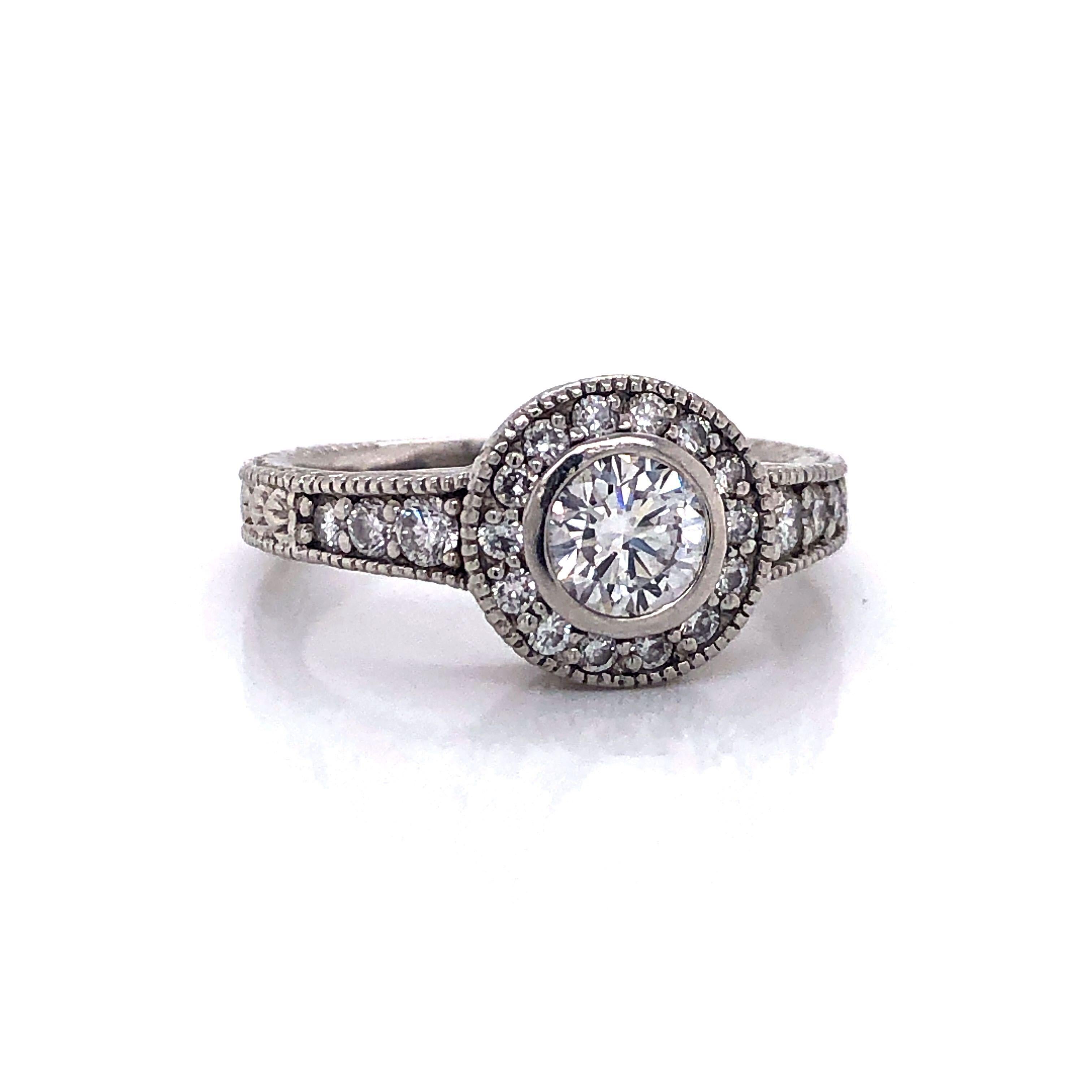 Round Cut Vintage Platinum and .83 Carat Diamond Halo Engagement Ring