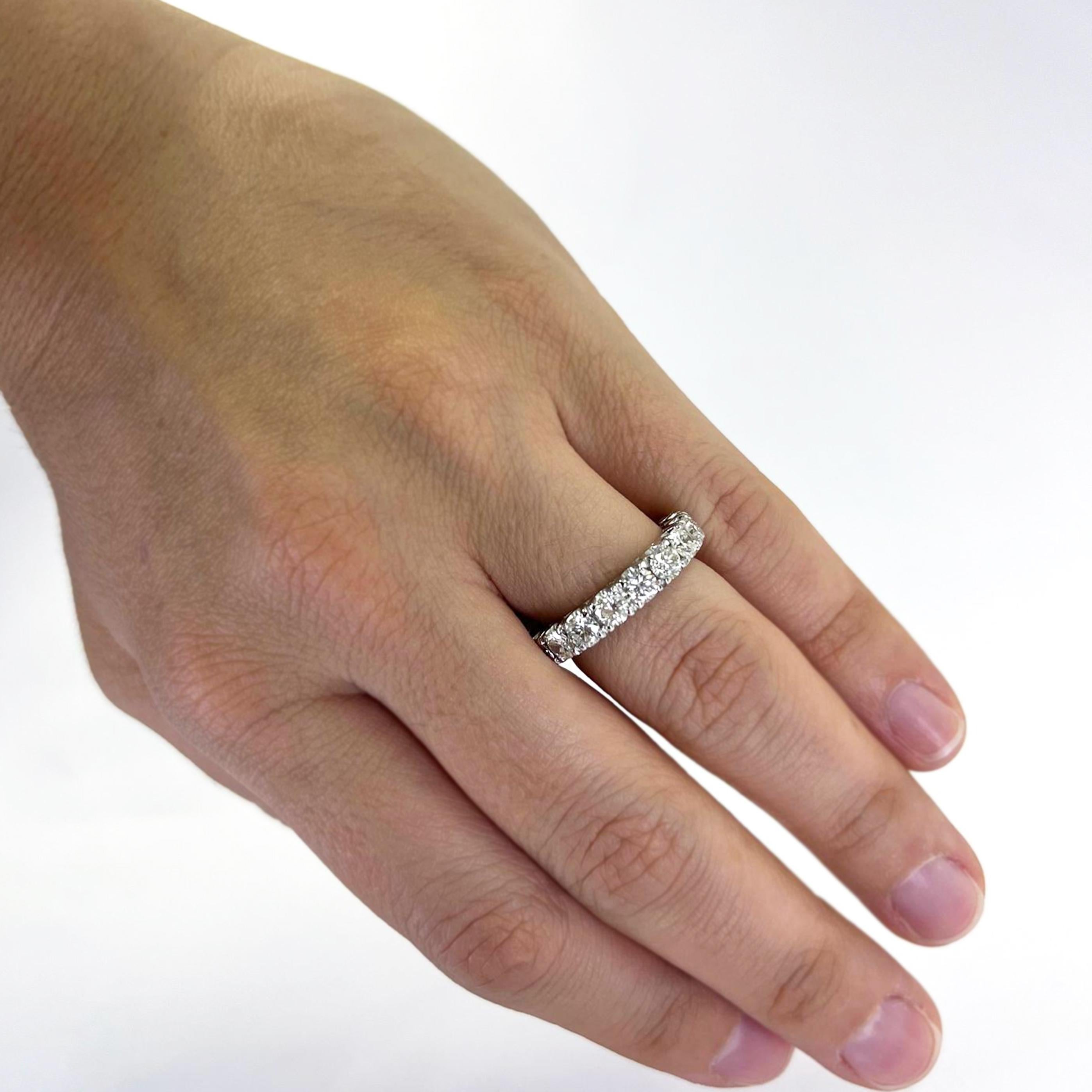 Platinum Eternity Band Featuring 18 Round Transitional Cut Diamonds of SI Clarity and J/K Color Totaling Approximately 3.00 Carat. Finger Size 6.5. Finished Weight is 6.3 Grams.
