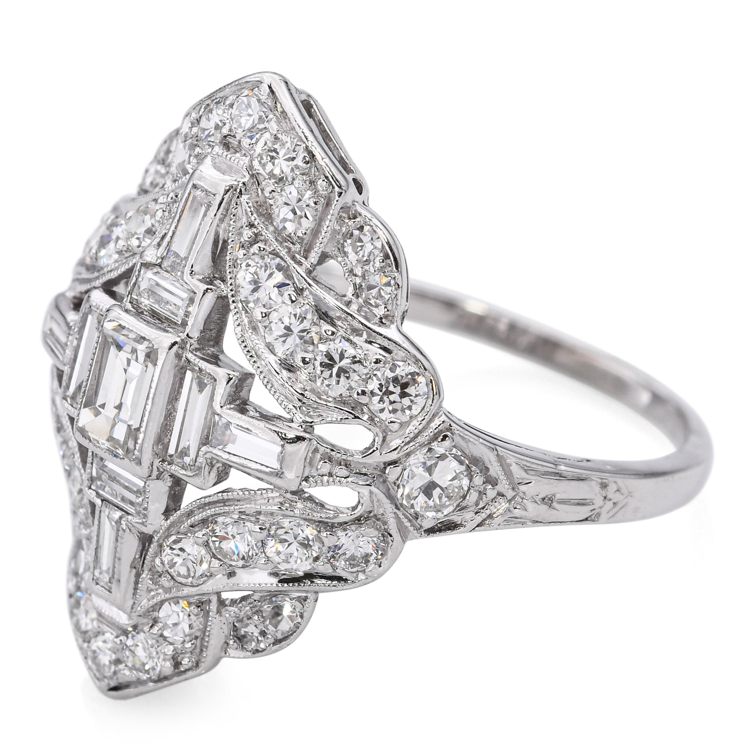 This stunning vintage ring is crafted in platinum and showcases a total of 1.1 carats of sparkling diamonds arranged in an intricate Art Deco motif. The geometric design reflects the elegance and precision of the 1920s era, with fine milgrain