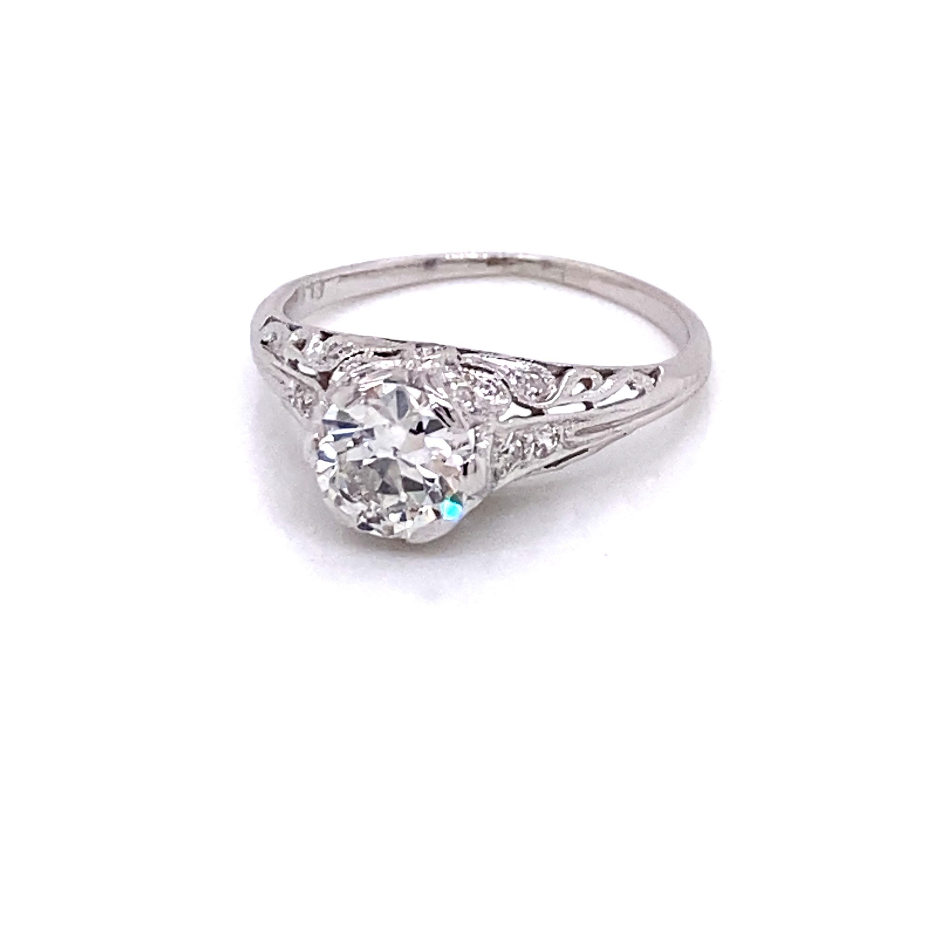 Vintage Platinum Art Deco Diamond Engagement Filigree Ring - The center European cut diamond weighs approximately 1.00ct and has the quality of H color and SI2 clarity. The diamond sits high in a platinum early Art Deco filigree setting that