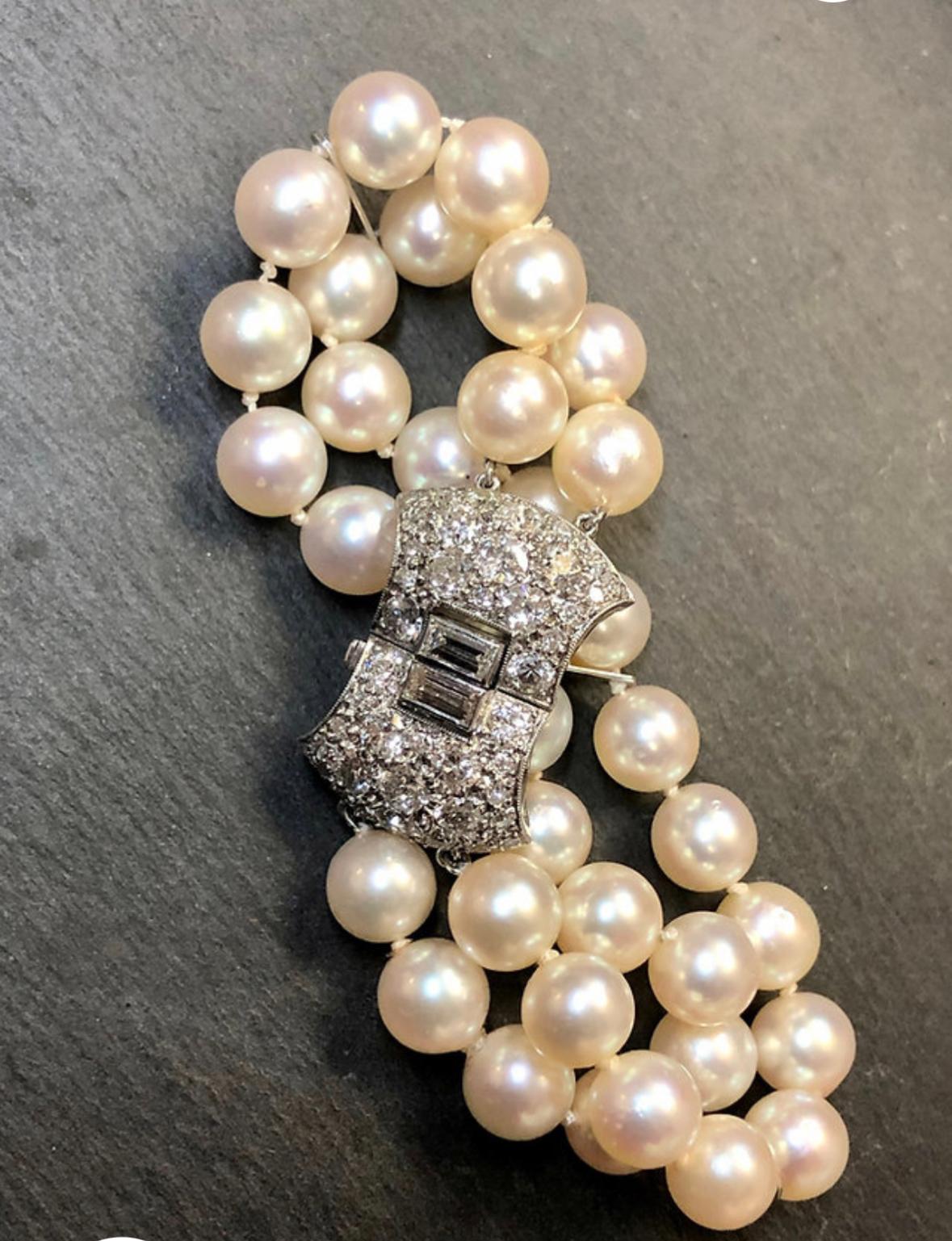 An original Art Deco period bracelet done in platinum and set with approximately 2.60cttw in H-J color Vs1-Si2 clarity old European cut diamonds attached to a double strand of 7mm cultured pearls with platinum separators.

Dimensions/Weight
6.50”